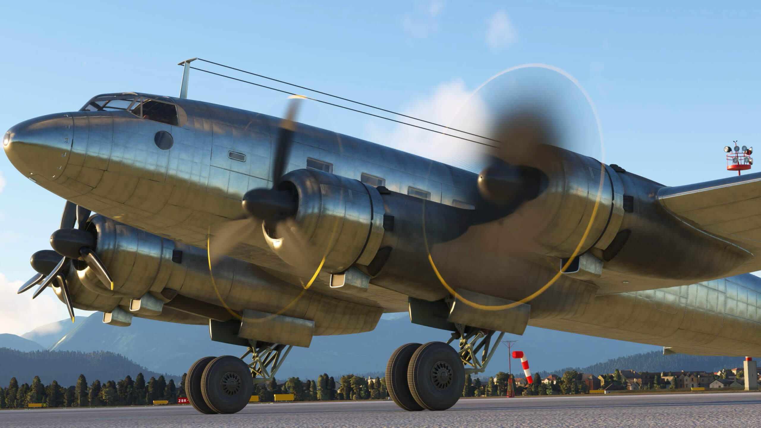 An Fw 200 Condor parked on the ground with engines running