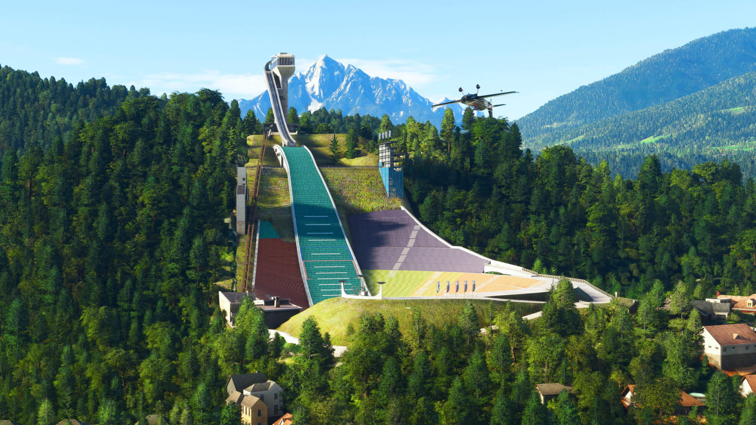 An Extra 300LT flies inverted over a ski jump