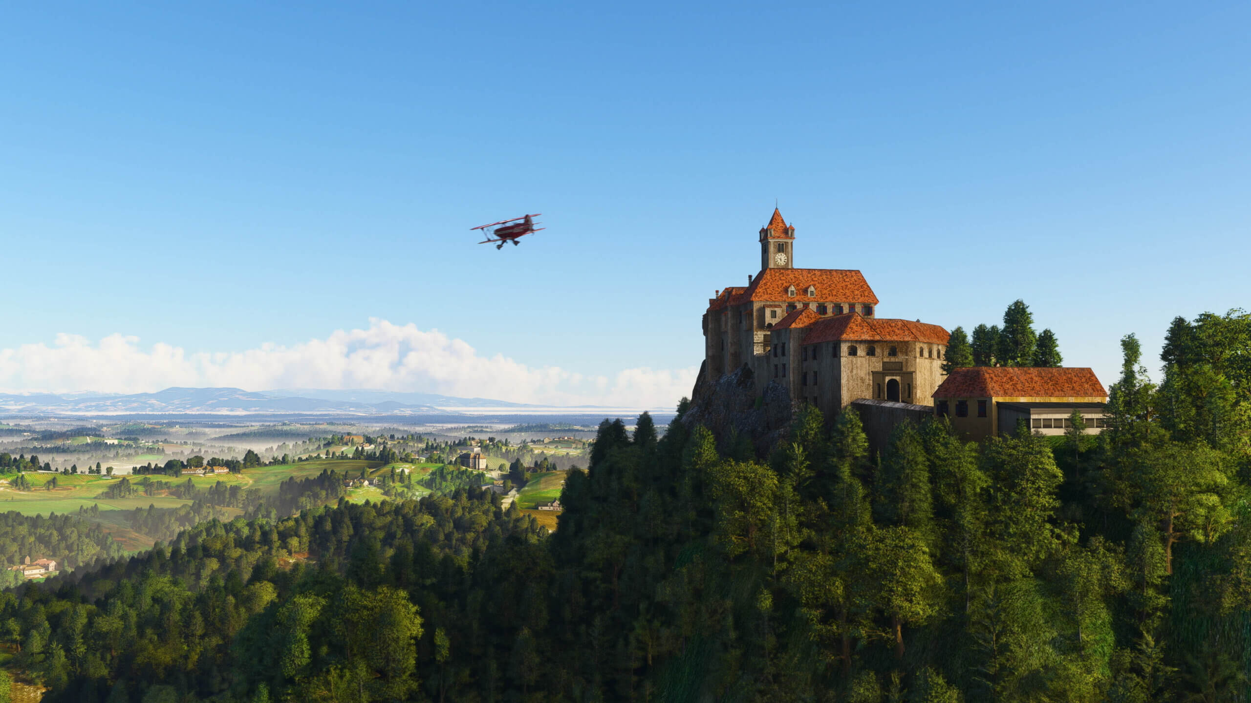 A Pitts Special flies over a European castle