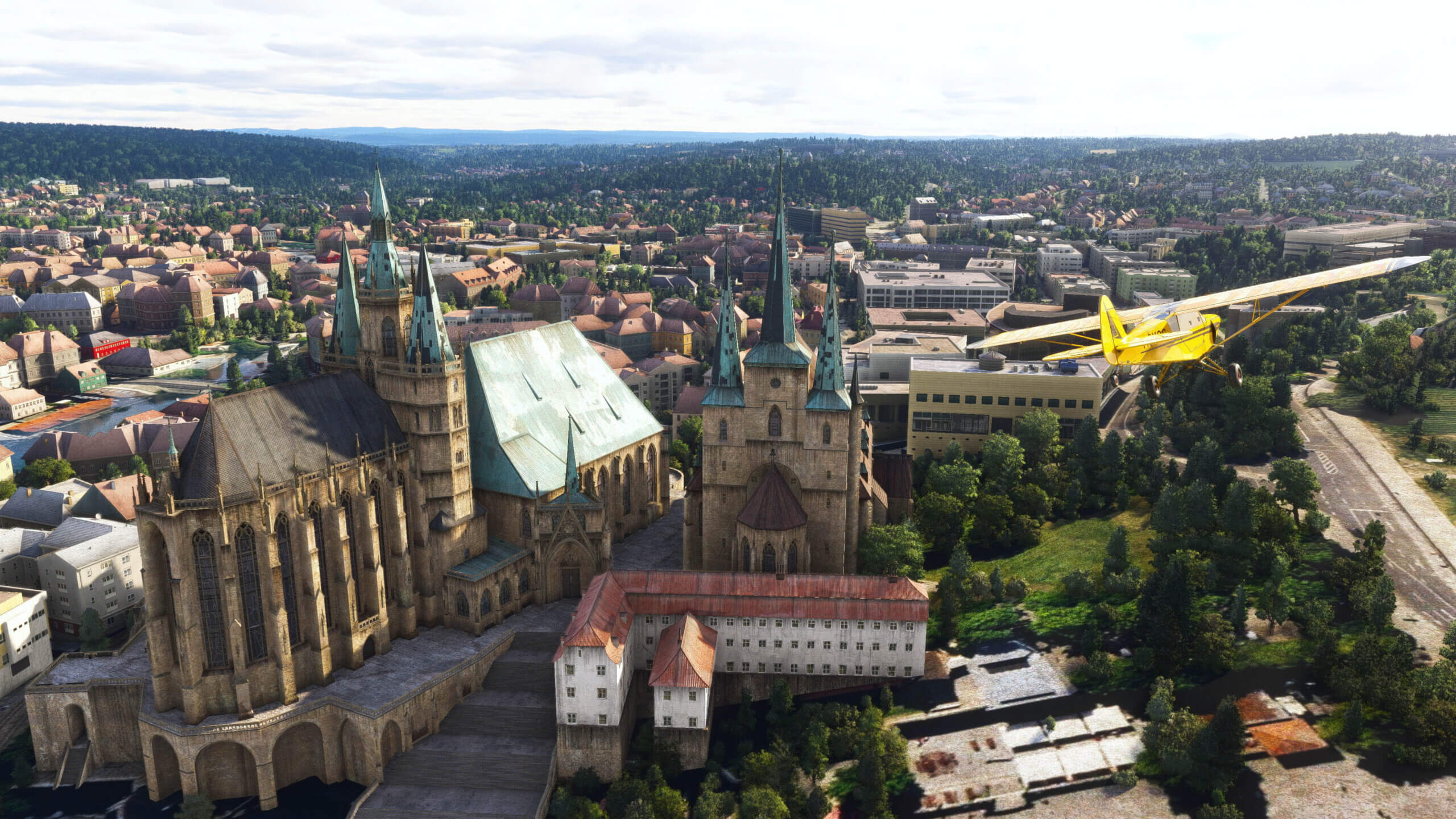 A Savage Cub flies over a European cathedral.