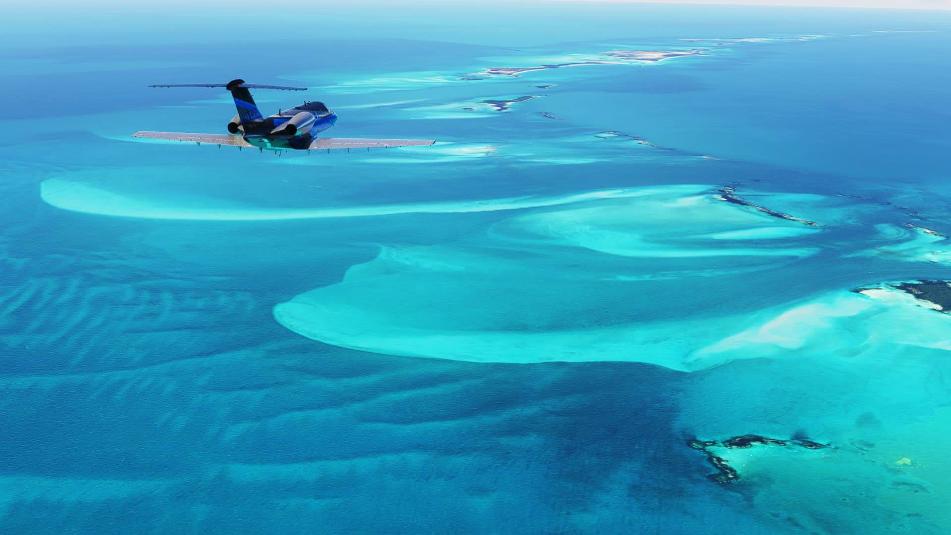 A business jet flies over azure blue ocean islands.