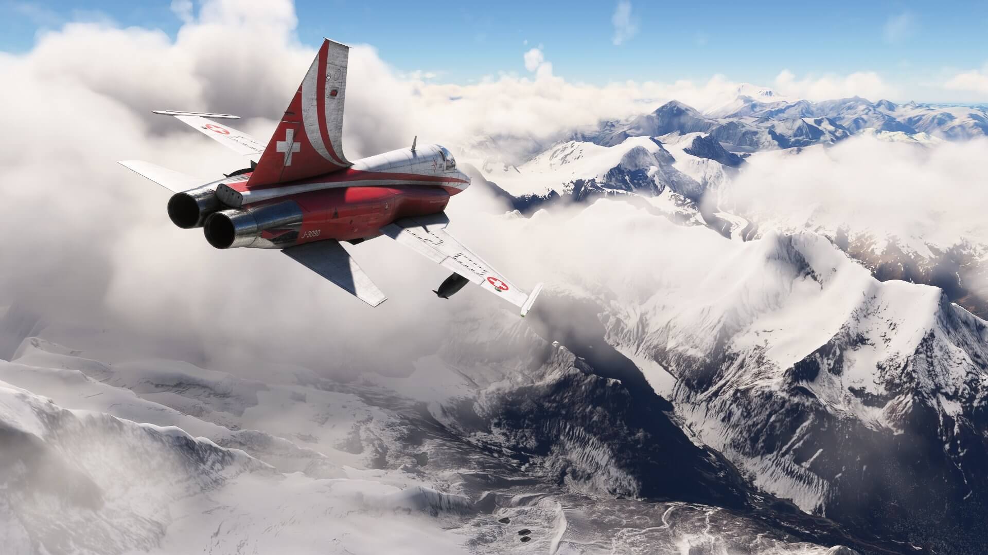 A Swiss F5 jet banks right to avoid clouds, whilst cruising above snowy mountains