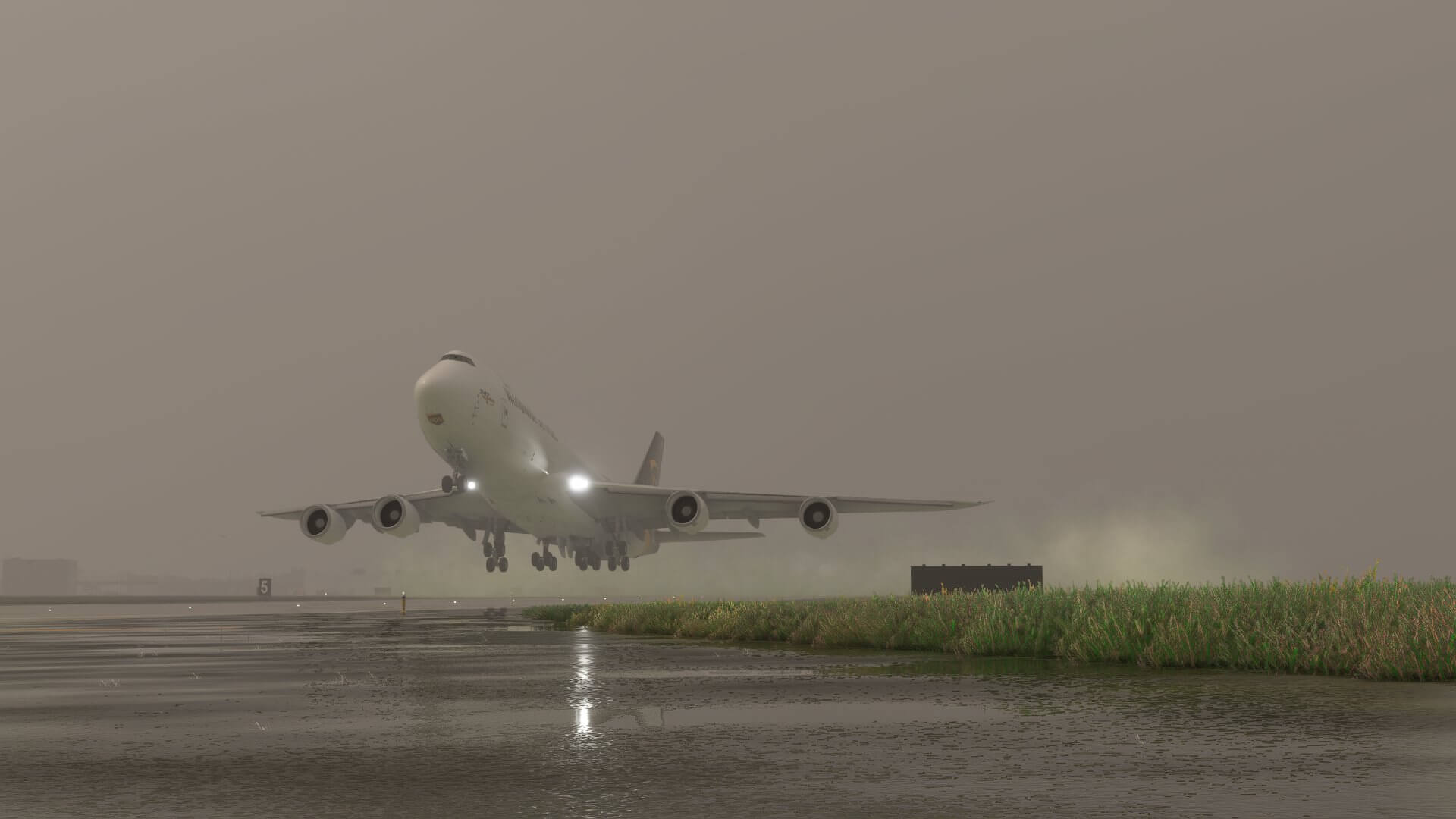 A Boeing 747-8 in UPS paint scheme takes off from a runway in low visibility