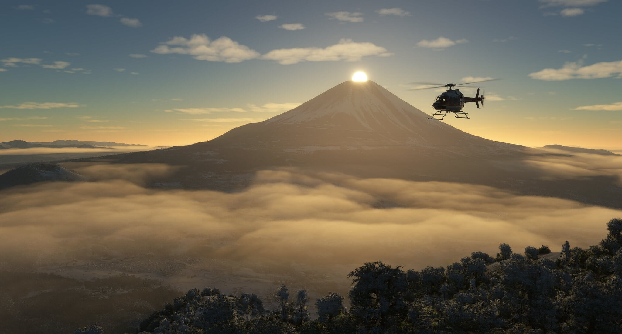 A Bell 407 helicopter flies away from Mount Fuji, with the sun peaking over the top of the volcano