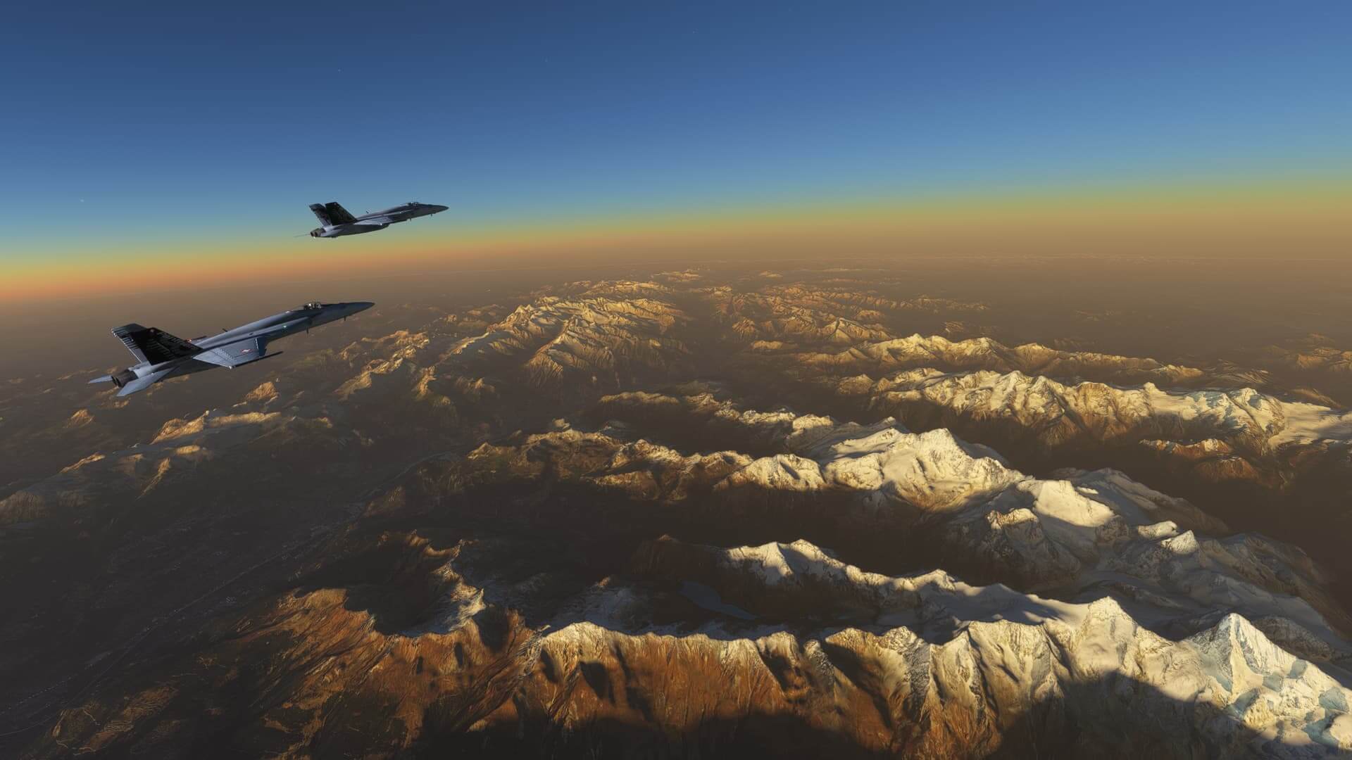 Two F/A-18 Hornet fighter jets cruise in close formation high above terrain below