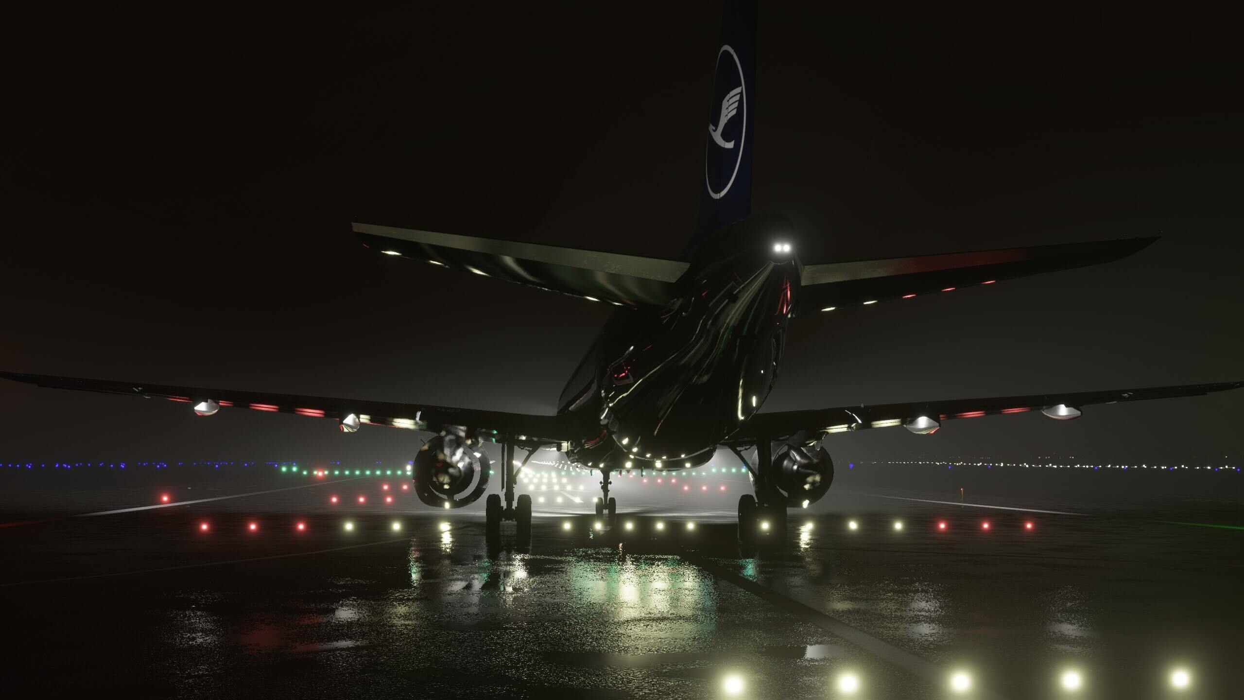 An Airbus A320 NEO lines up for takeoff at night, with the runway lights illuminating the way ahead