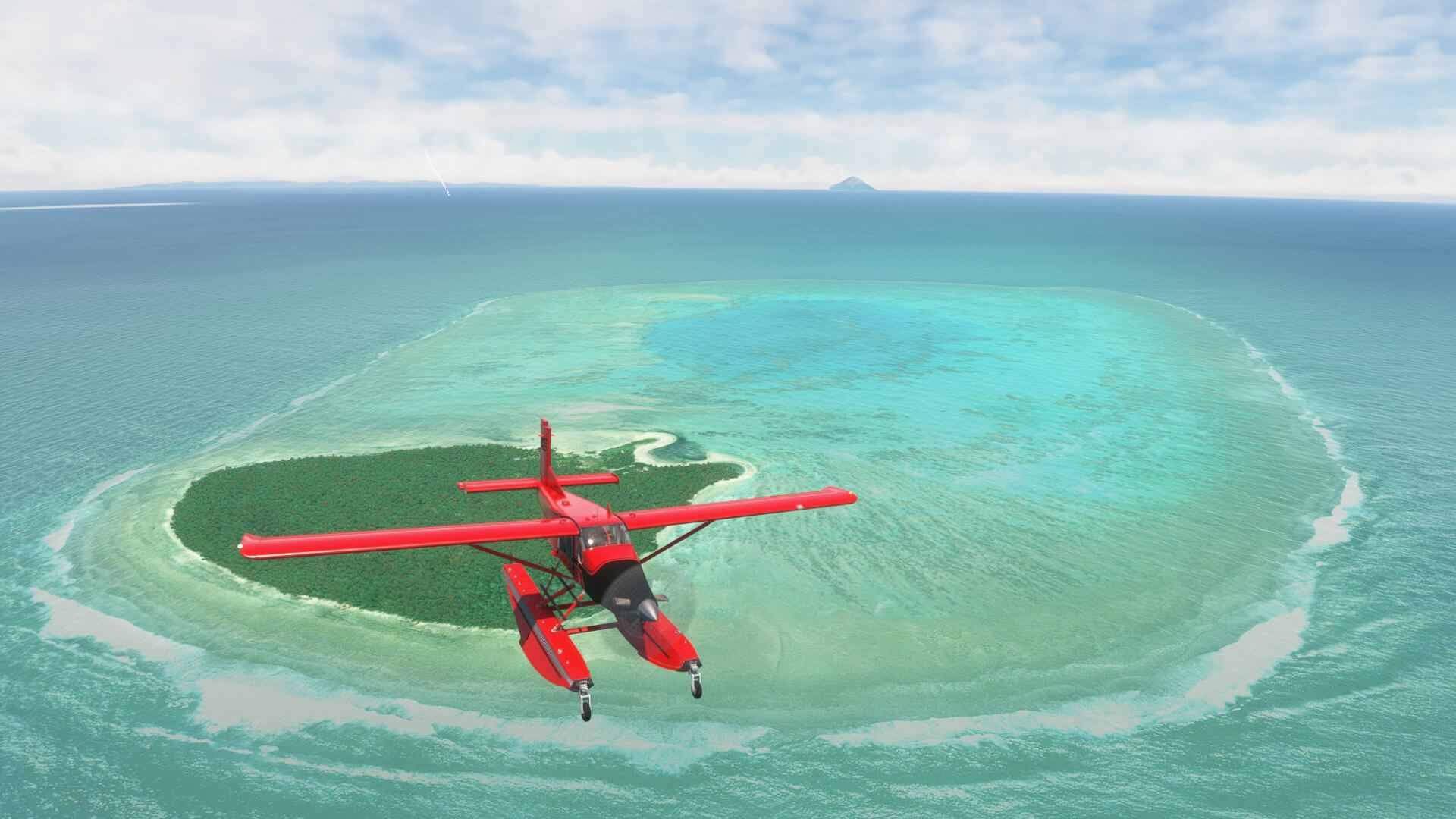 A Pilatus PC-6 Porter in red paint flies above a Caribbean island