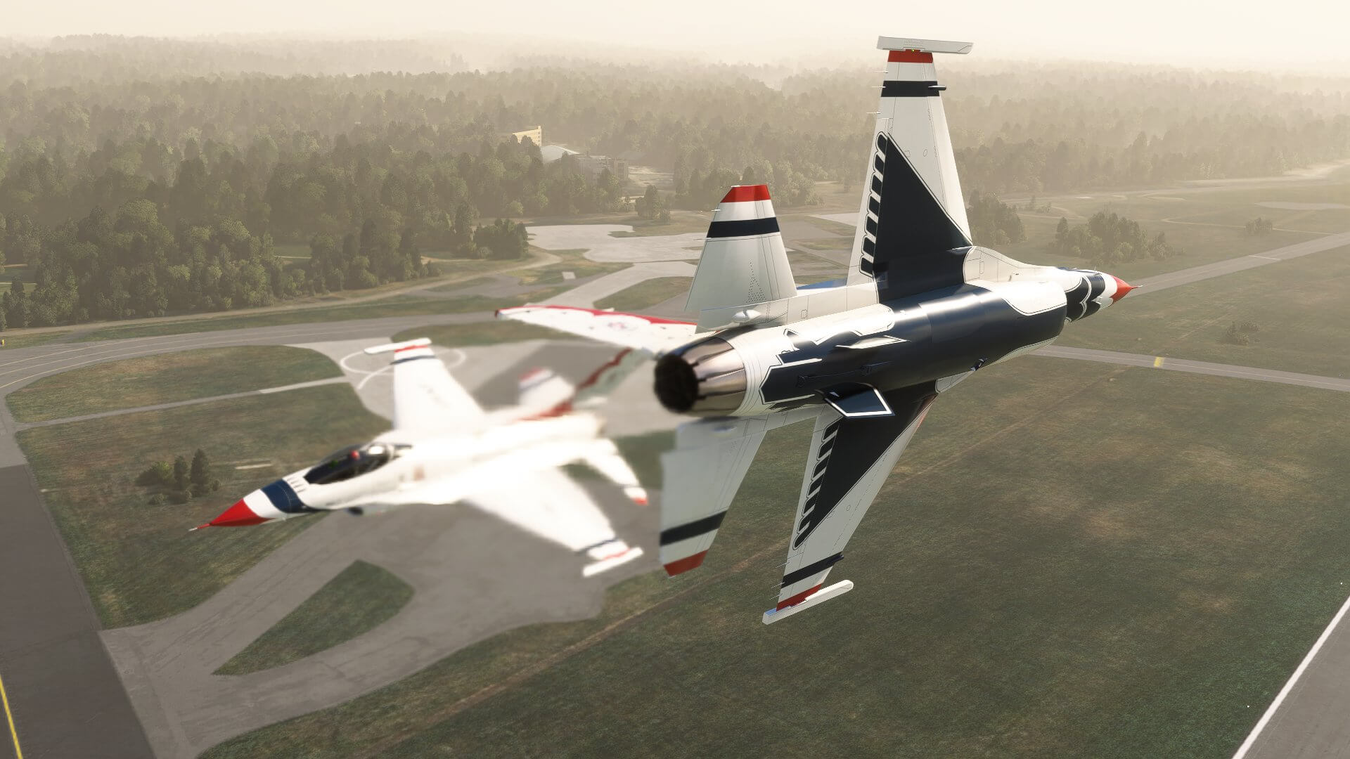 Two F-16 jets from the USAF Thunderbirds pass during a head on manoeuvre