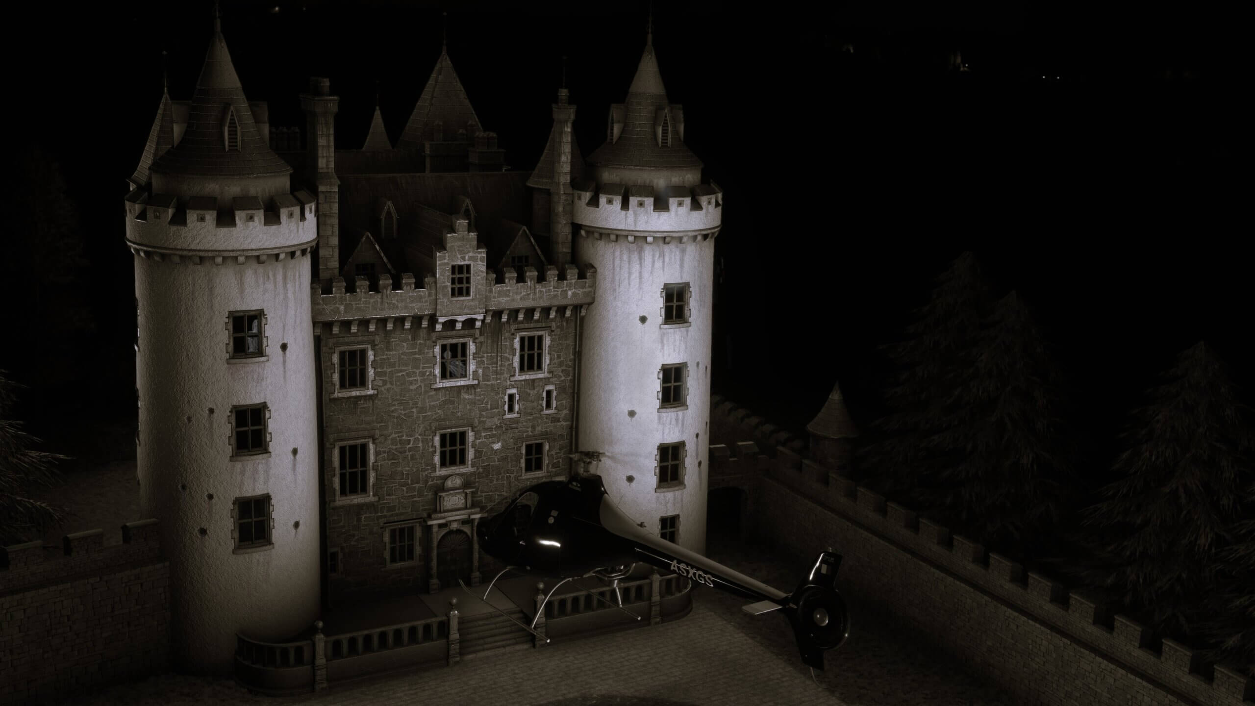 A helicopter hovers near a haunted mansion at night