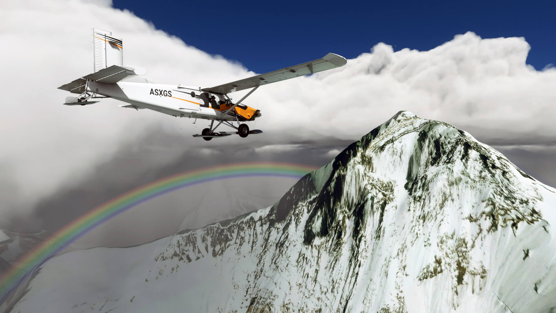 A Pilatus PC-6 Porter flies towards a snowy mountain, with a rainbow in the distance