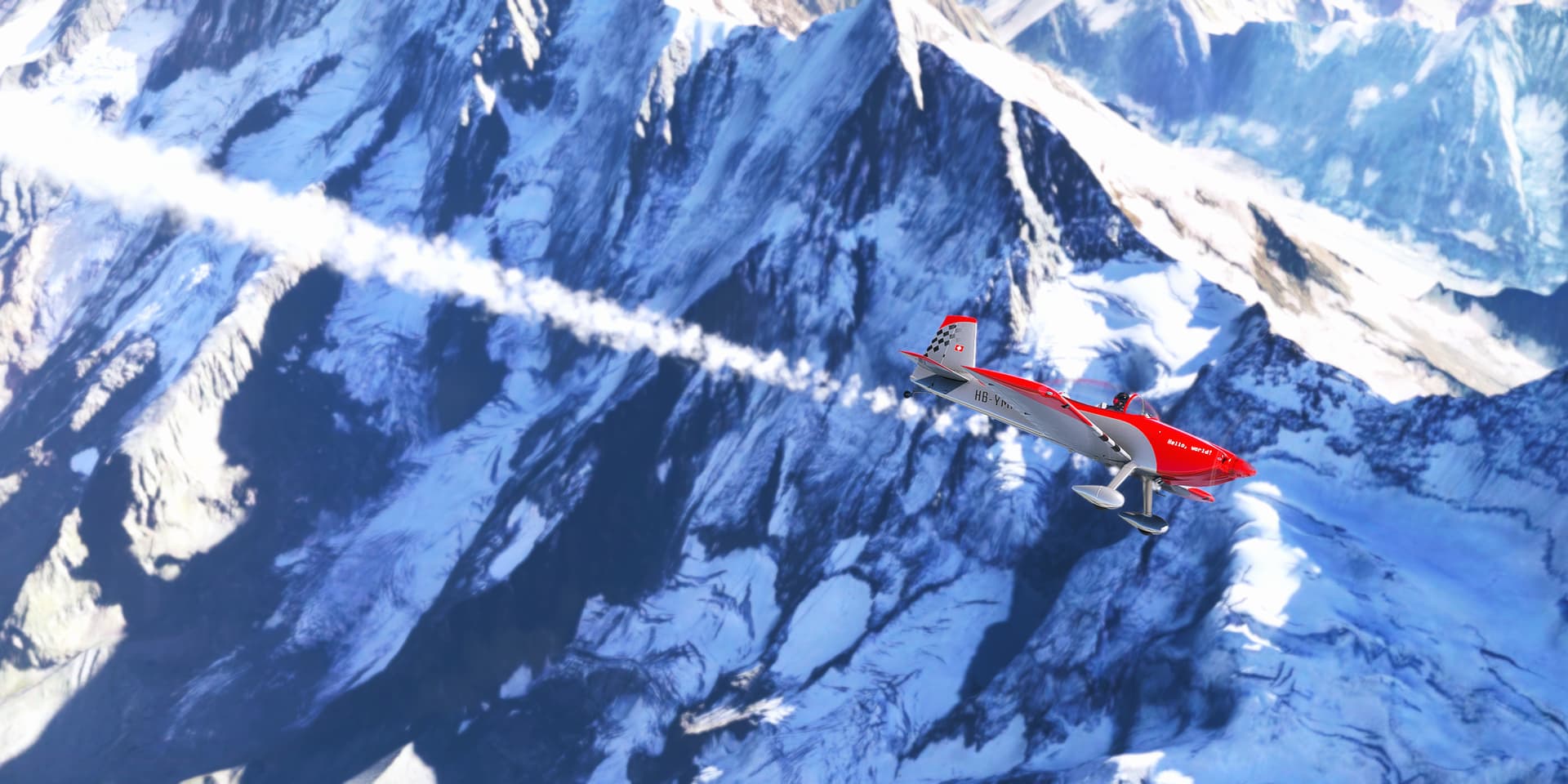 A red aerobatic aircraft with smoke pluming behind flies over a snow covered mountain