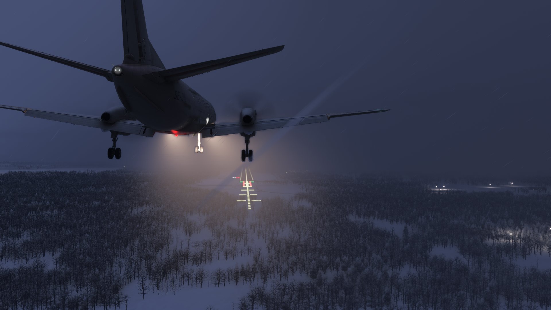 A Saab 340 on final approach to a brightly lit runway with snow surrounding the airport