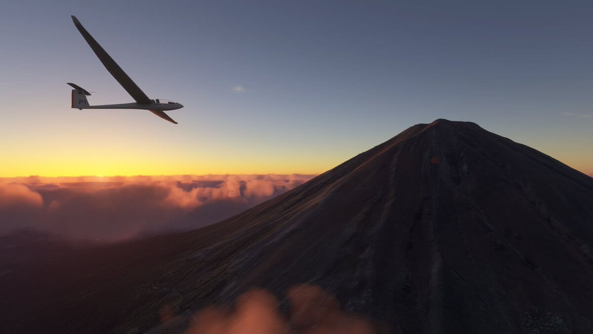 a glider takes a closer look at a volcano during golden hour