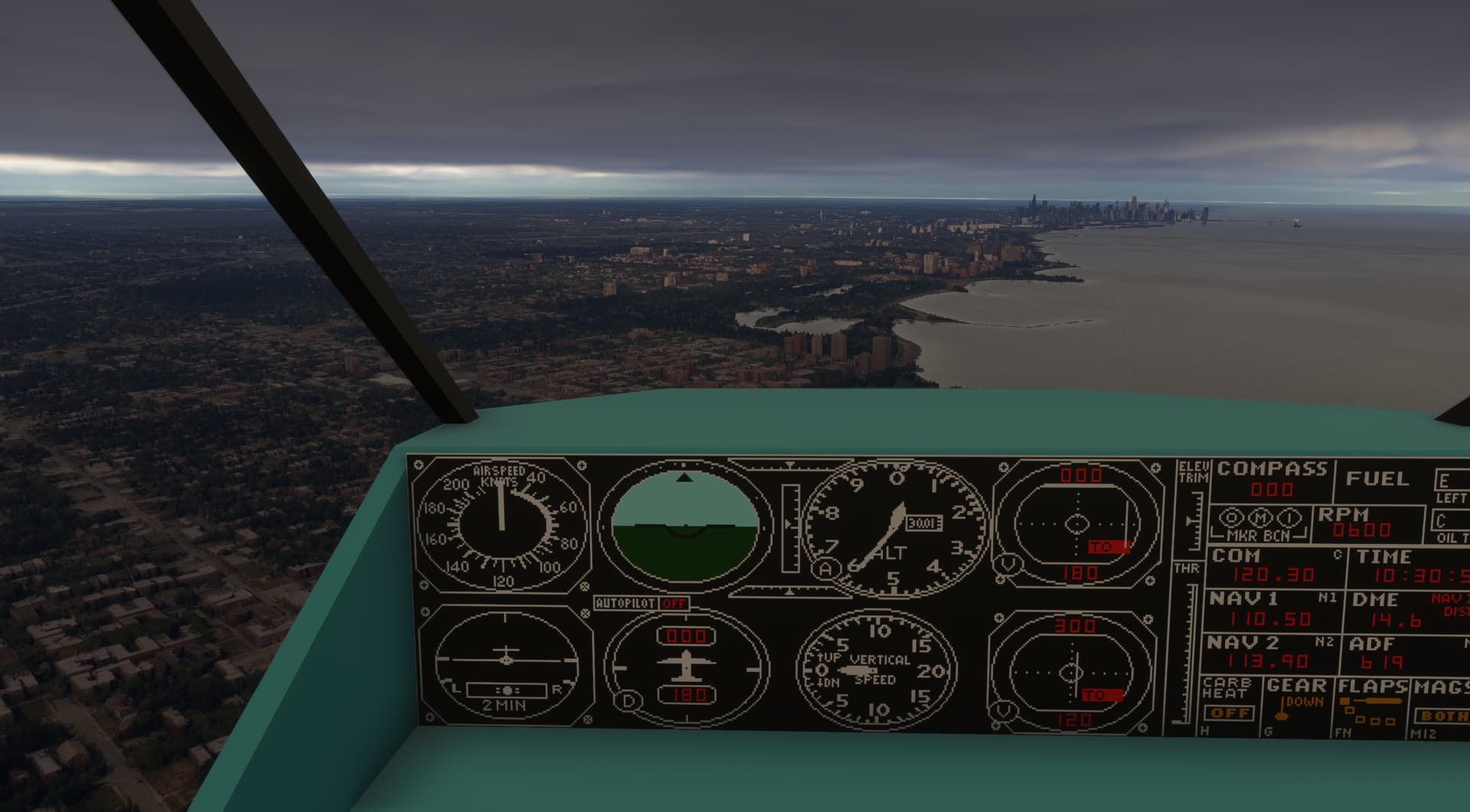 A retro cockpit from an old flight simulator aircraft flies along the shoreline of a city