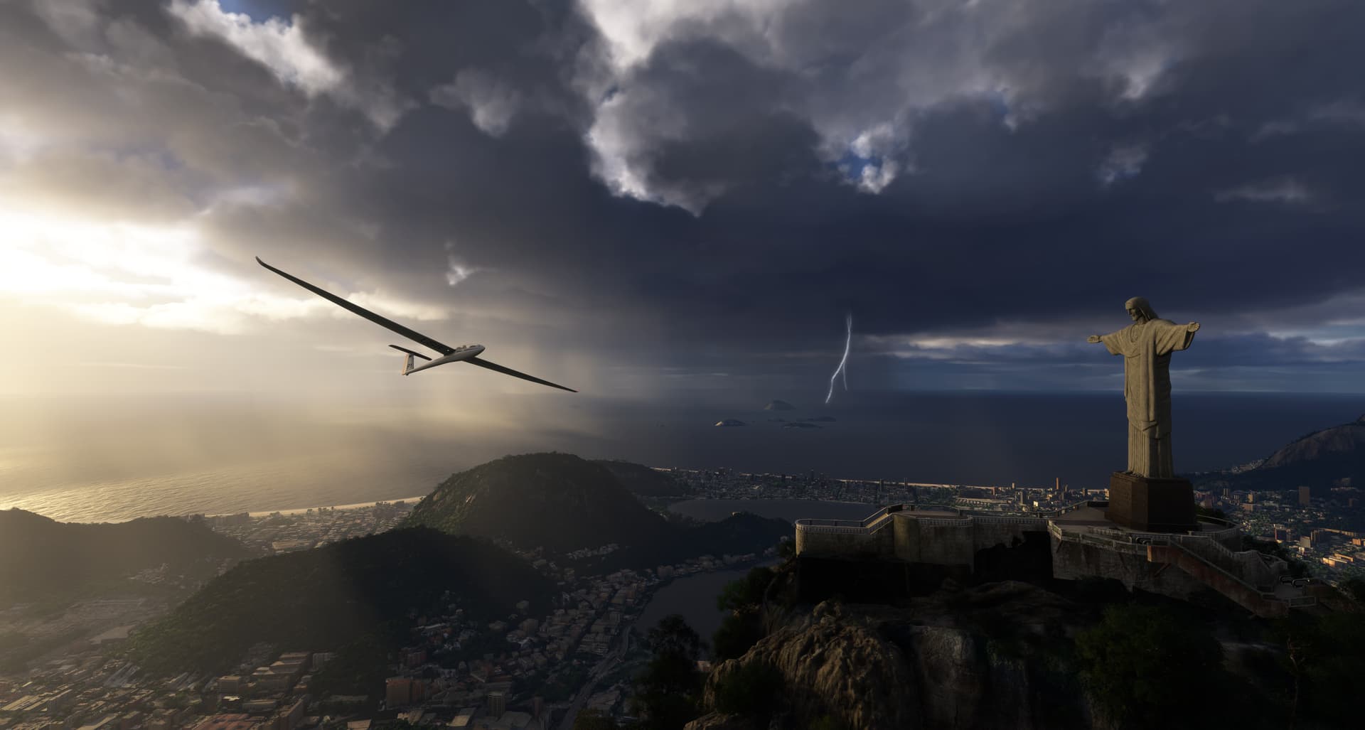 A glider flies past Christ the Redeemer in Rio De Janeiro, Brazil, with a thunderstorm in the distance.