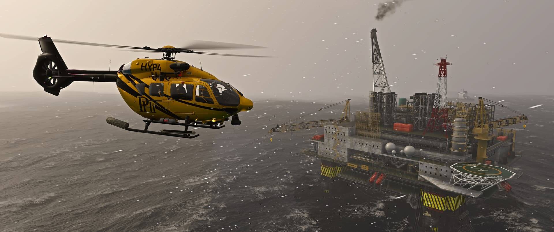 A yellow H145 helicopter circles an oil rig during a storm