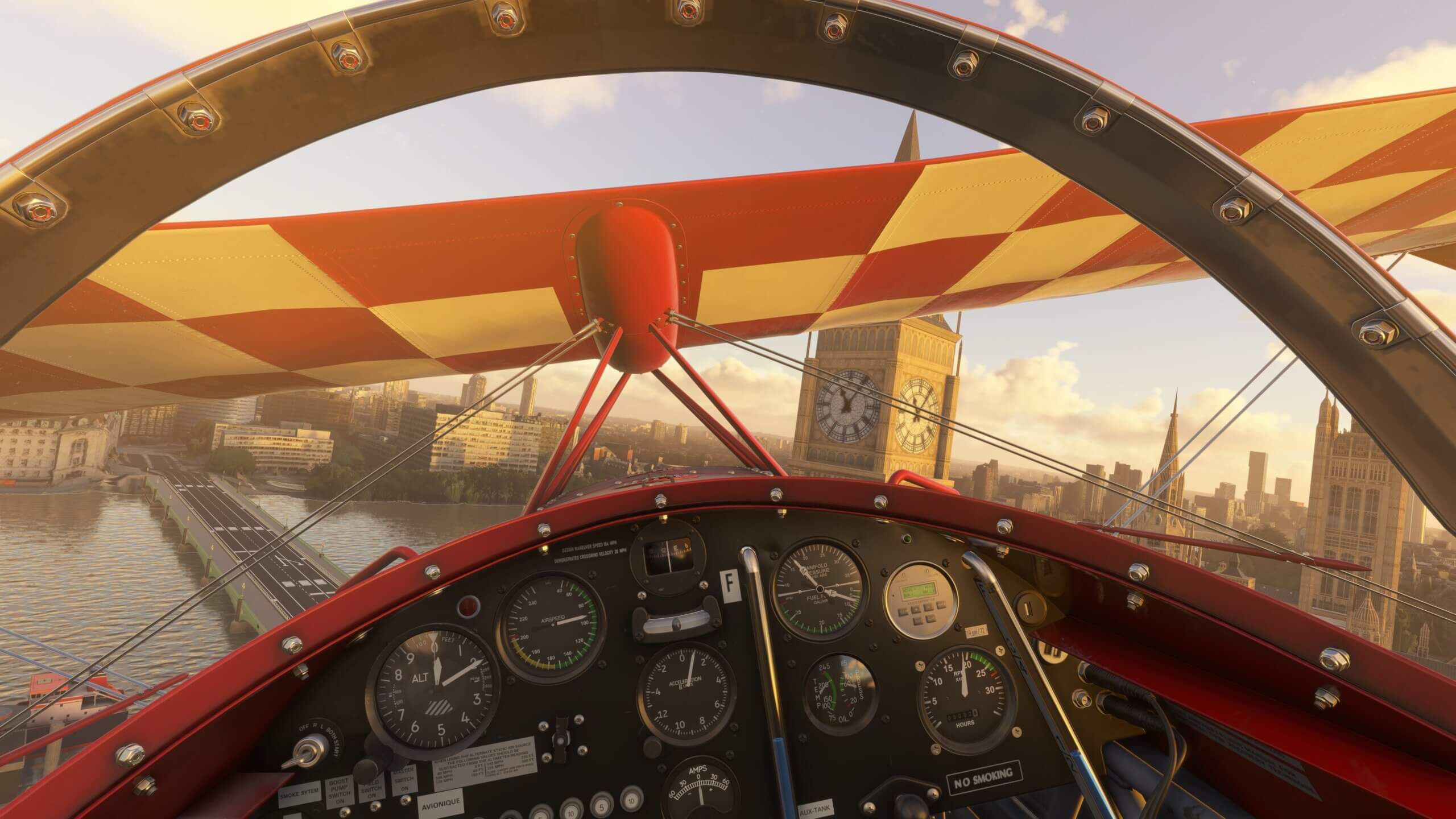 Interior view from the cockpit of a Pitts Special flying over London. Big Ben and the British House of Parliament are visible in the background.