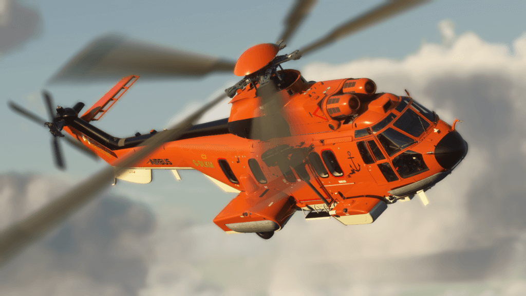An orange helicopter banks to the right.