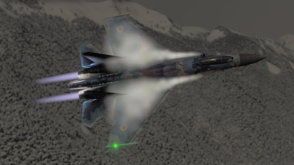 A fighter jet in blue camouflage paint with after burners engaged turns in a sharp right hand manouver