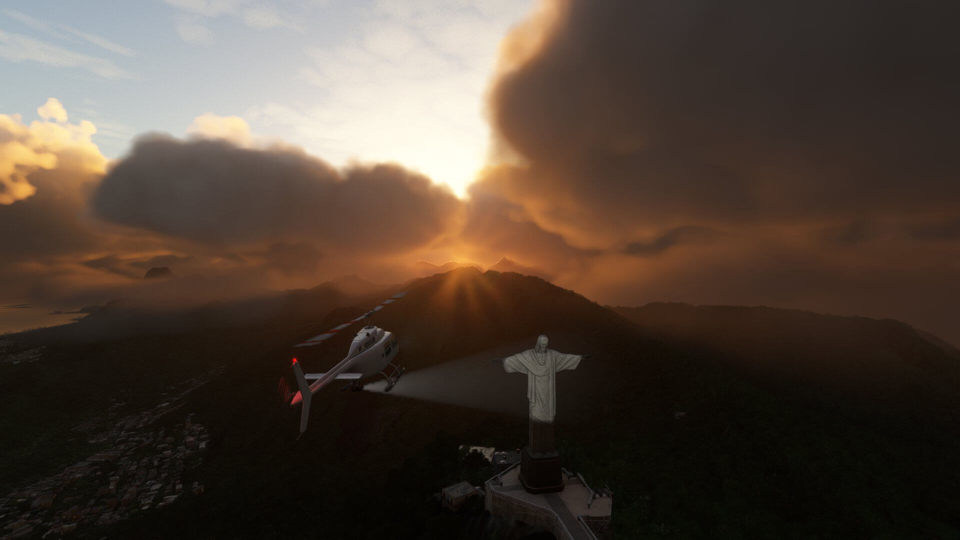 A Bell 407 hovers next to the Christ The Redeemer statue in Rio De Janeiro