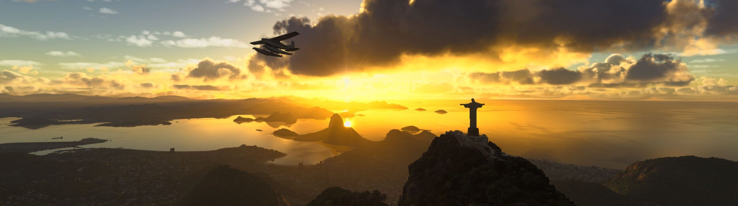 A propeller float plane aircraft flies past the Christ The Redeemer statue during sunset in Rio De Janeiro