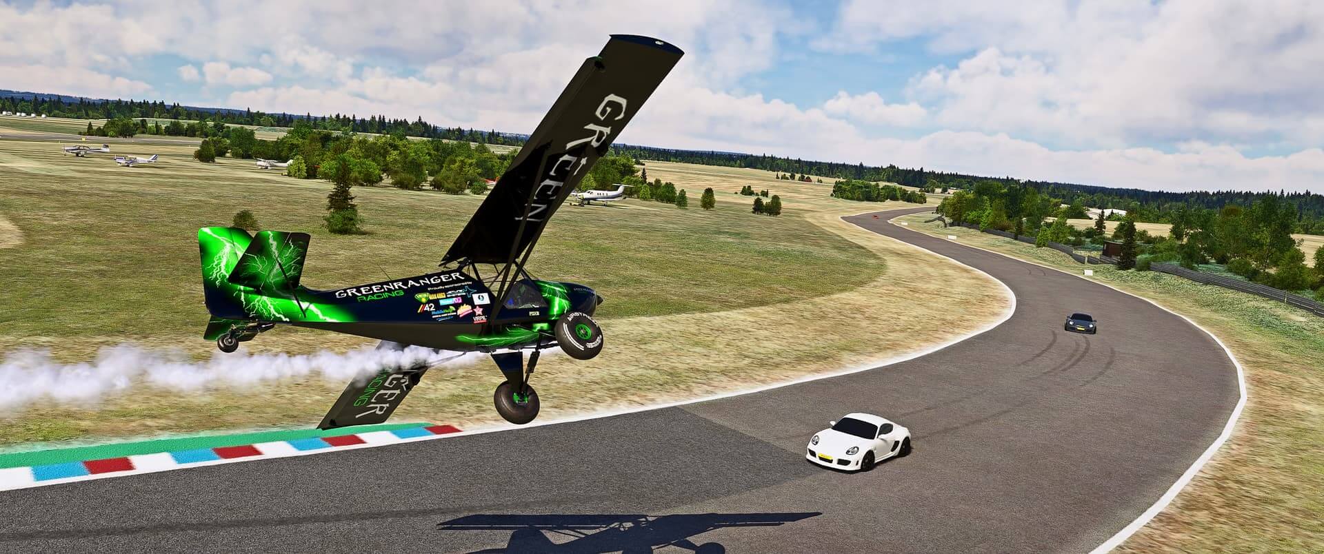 A Greenranger Racing propeller aircraft with white smoke pluming behind flies low over a car racing track