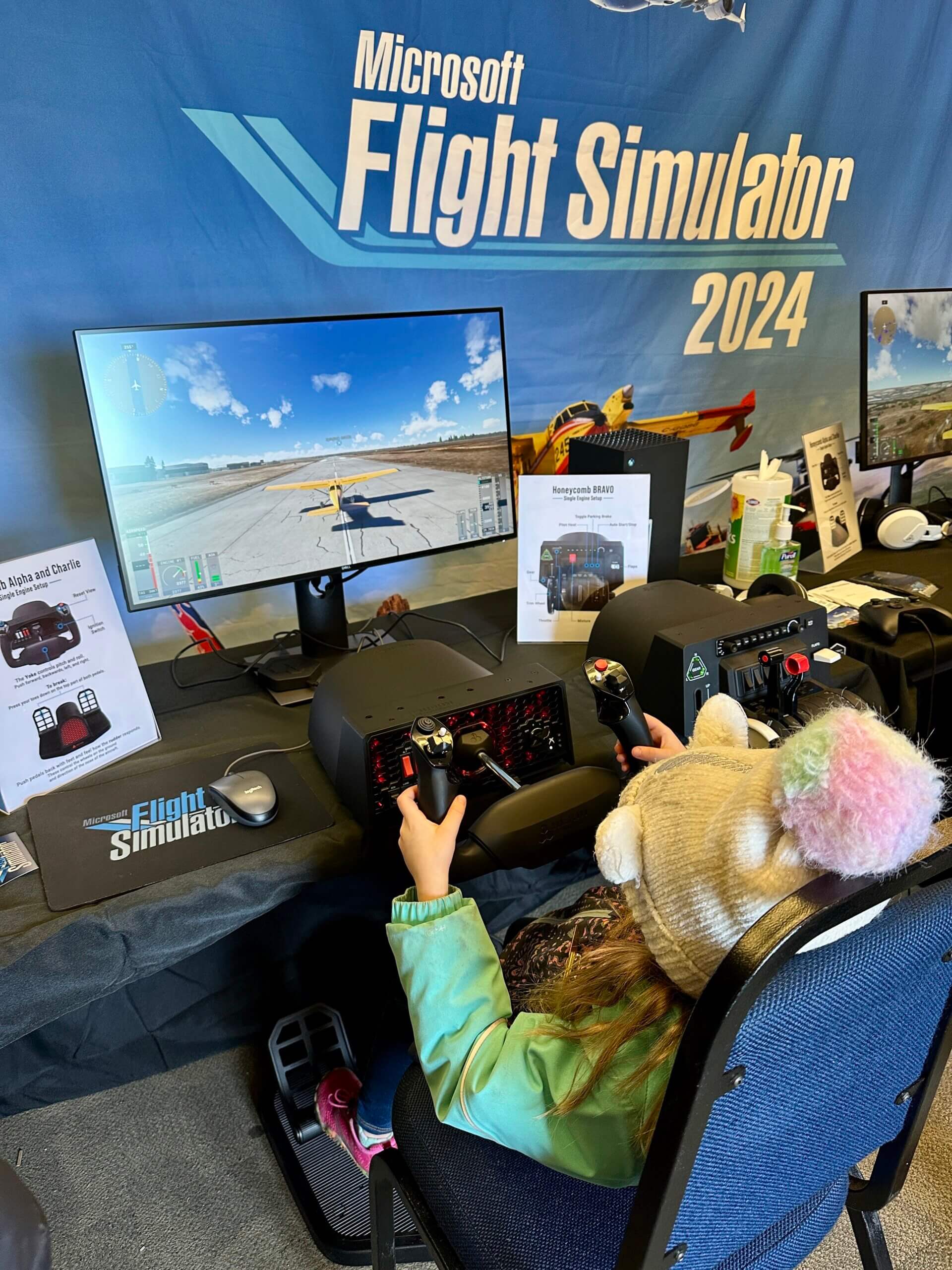 A young girl prepares for takeoff in Microsoft Flight Simulator 2024 at the Women in Aviation event on March 8.