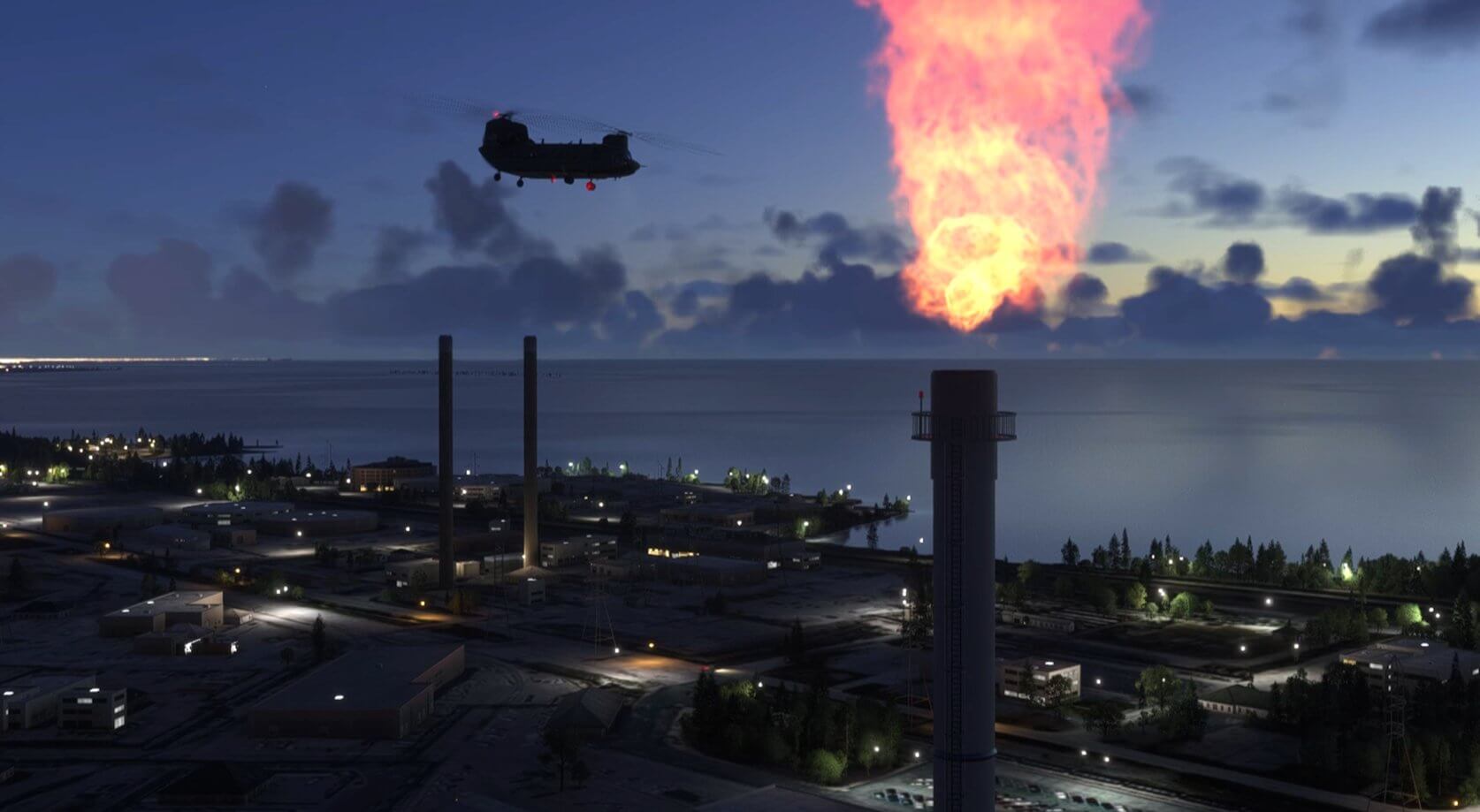 A Chinook helicopter flies past an industrial site
