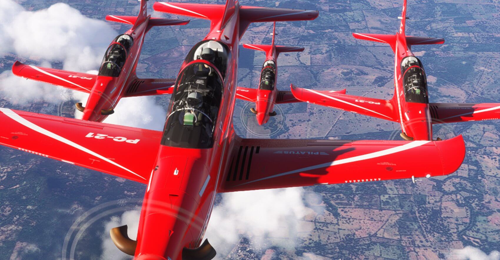 Four red PC-12's fly in close formation
