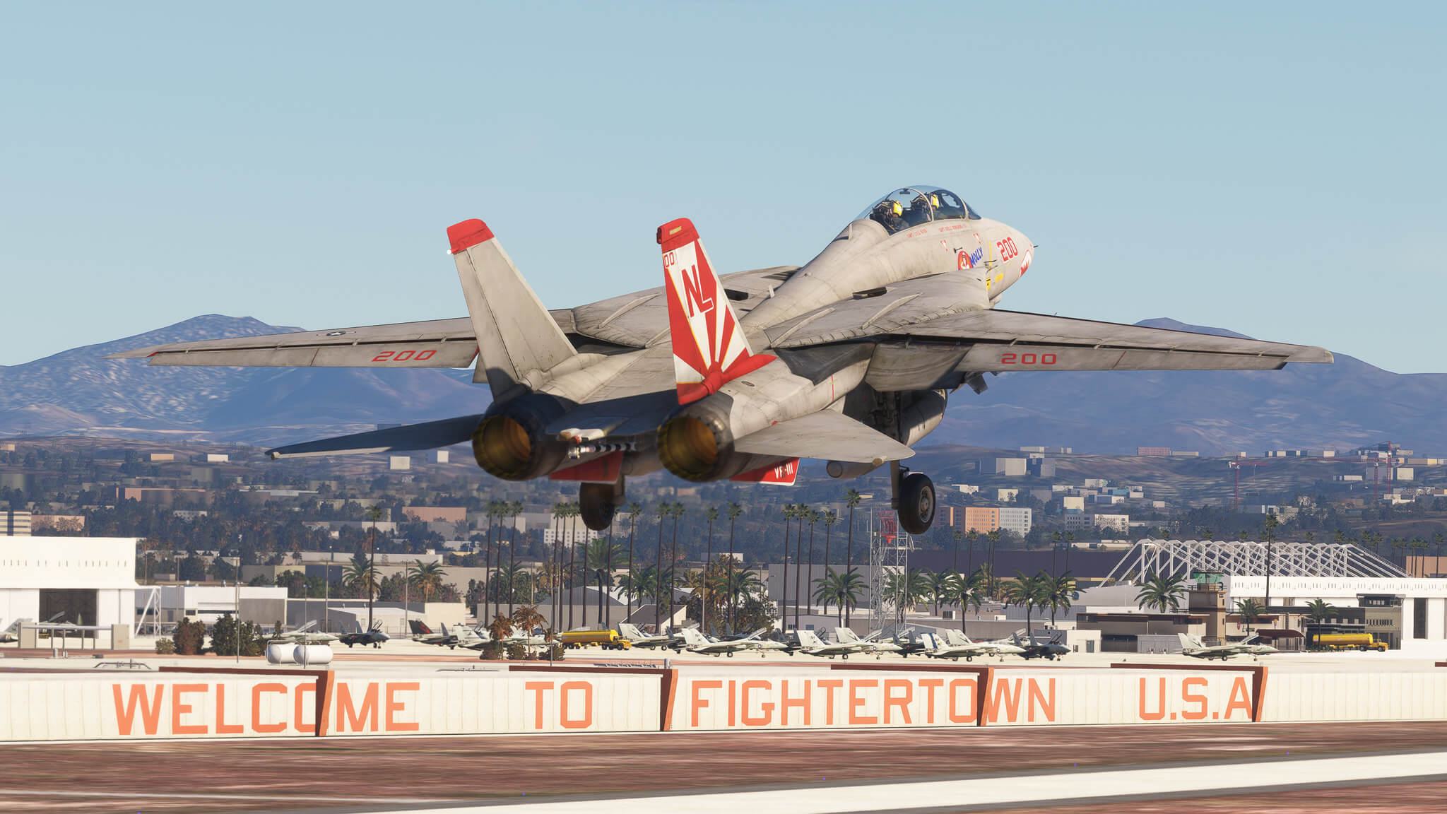 An F-14 Tomcat taking off with afterburners engaged