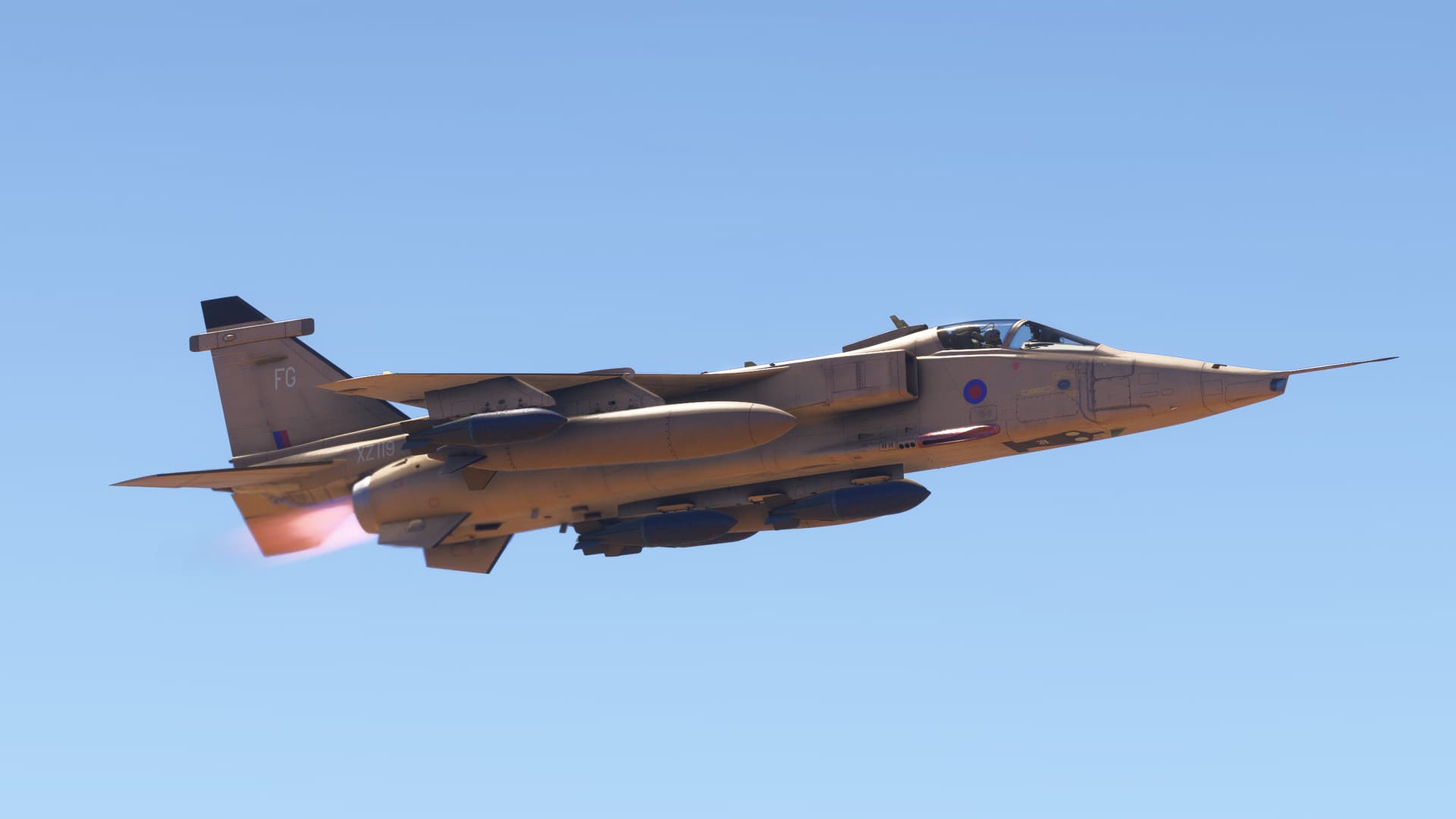 A Jaguar fighter jet flies at high speed with afterburners engaged