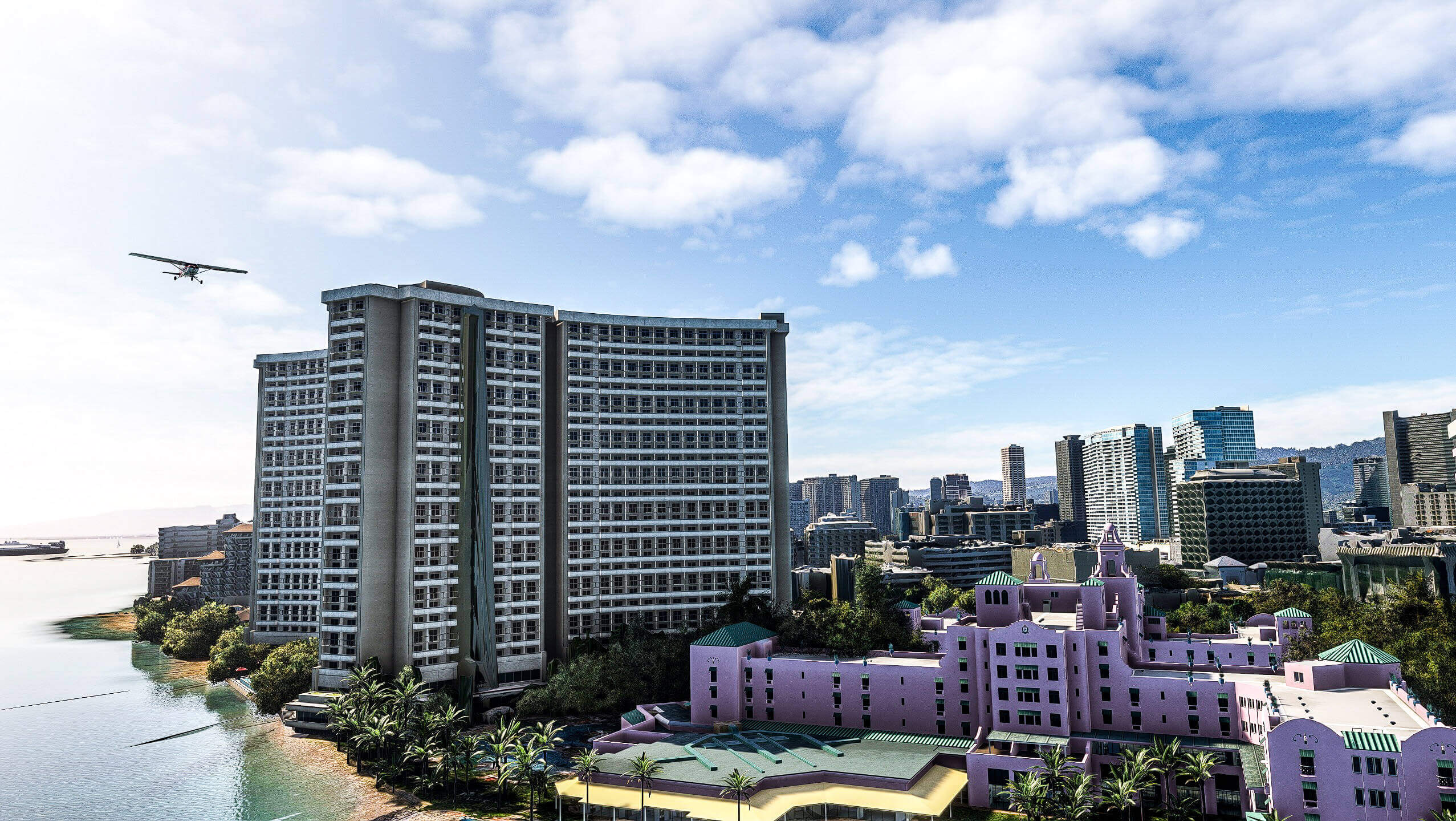 A Cessna flies above hotels in Honolulu, Hawaii