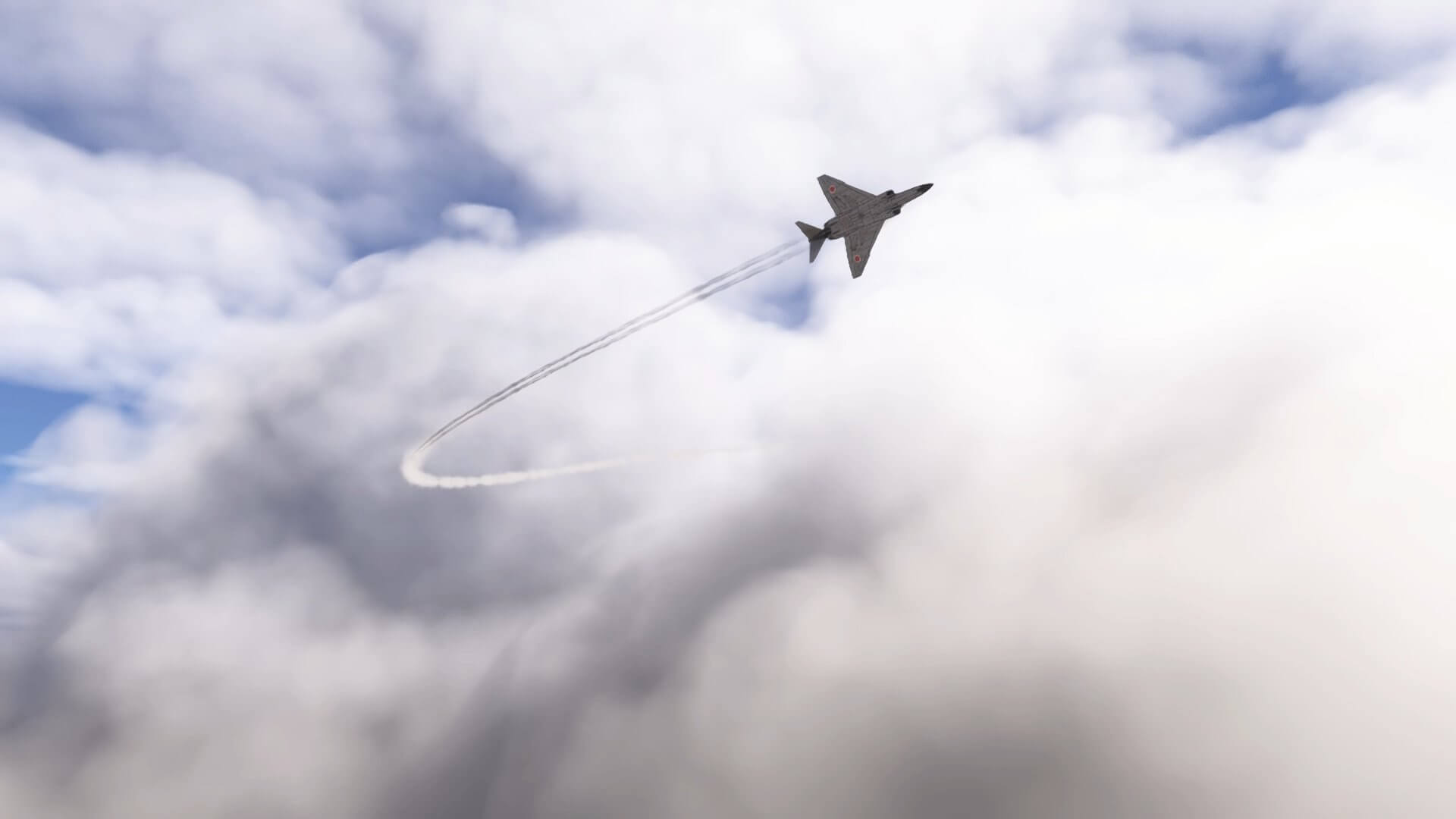 A military jet with contrails streaming behind banks left to avoid clouds