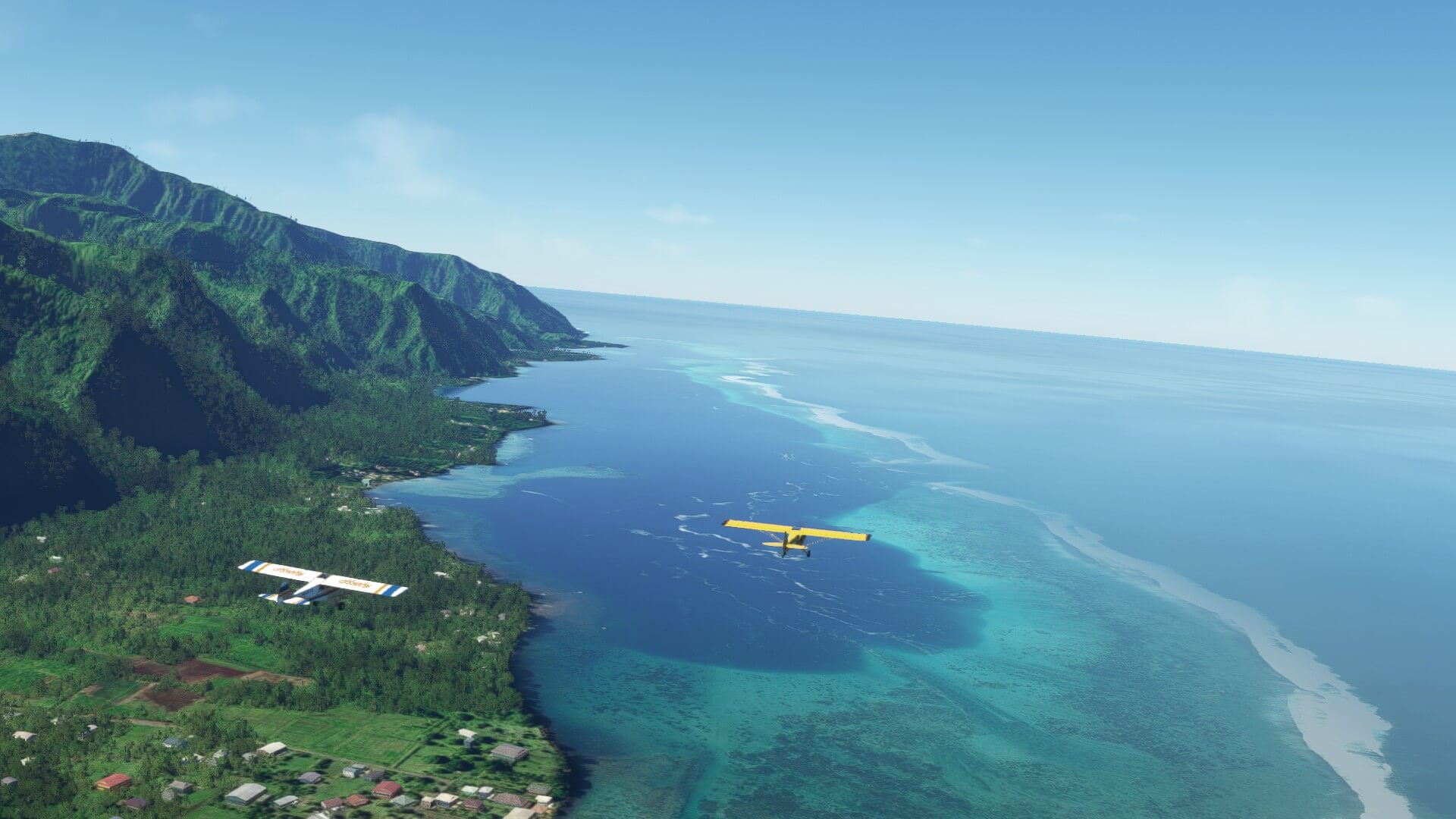 Two X-Cub aircraft fly across a coastline with mountains in view