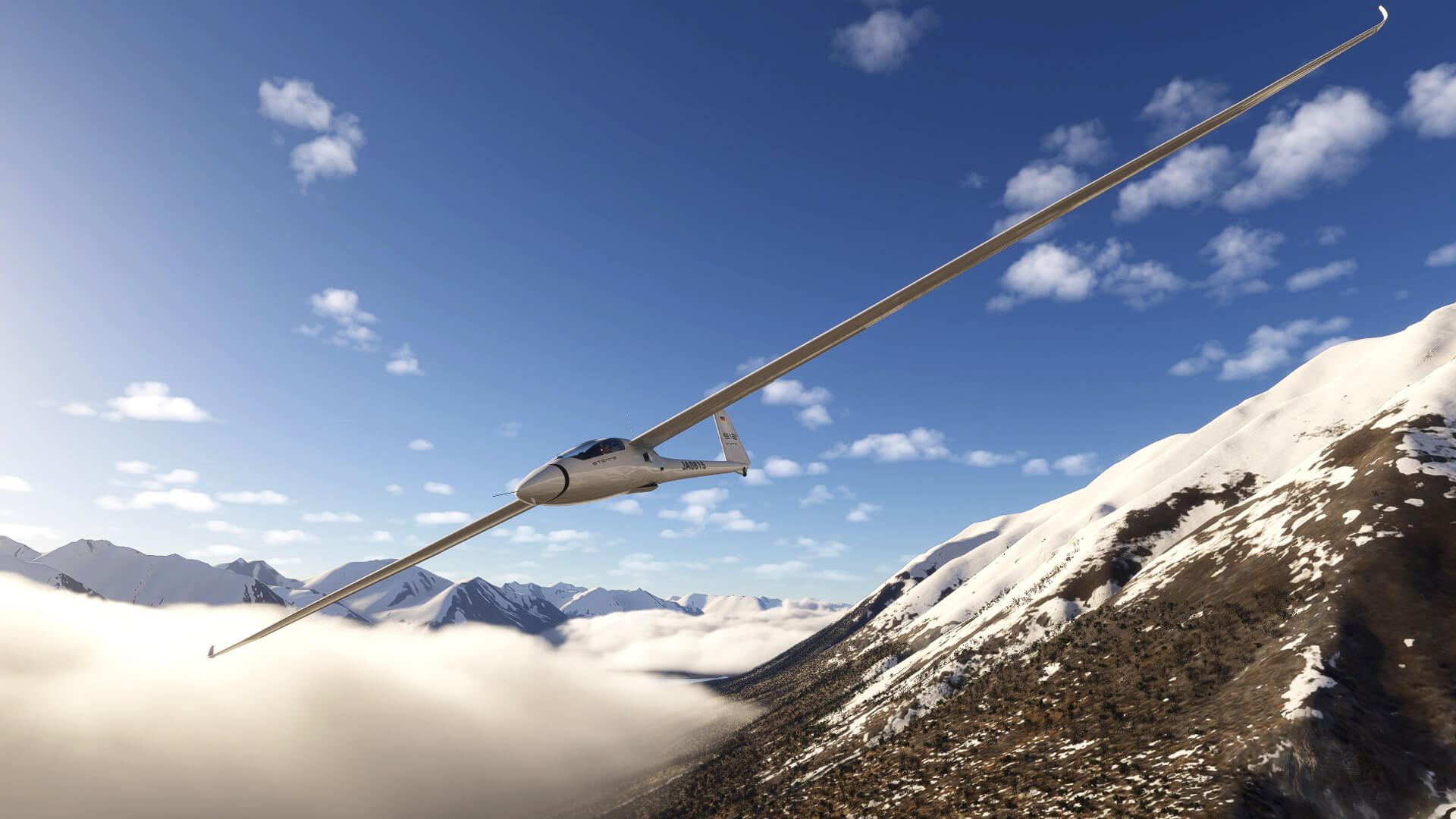 A glider banks to the right to avoid terrain with thick fog covering the valley below