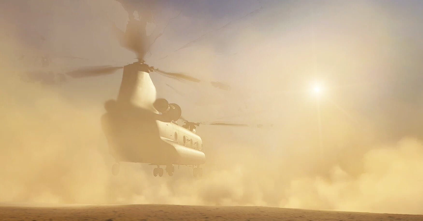 A cargo helicopter kicks up dust in a desert on a hot sunny day.