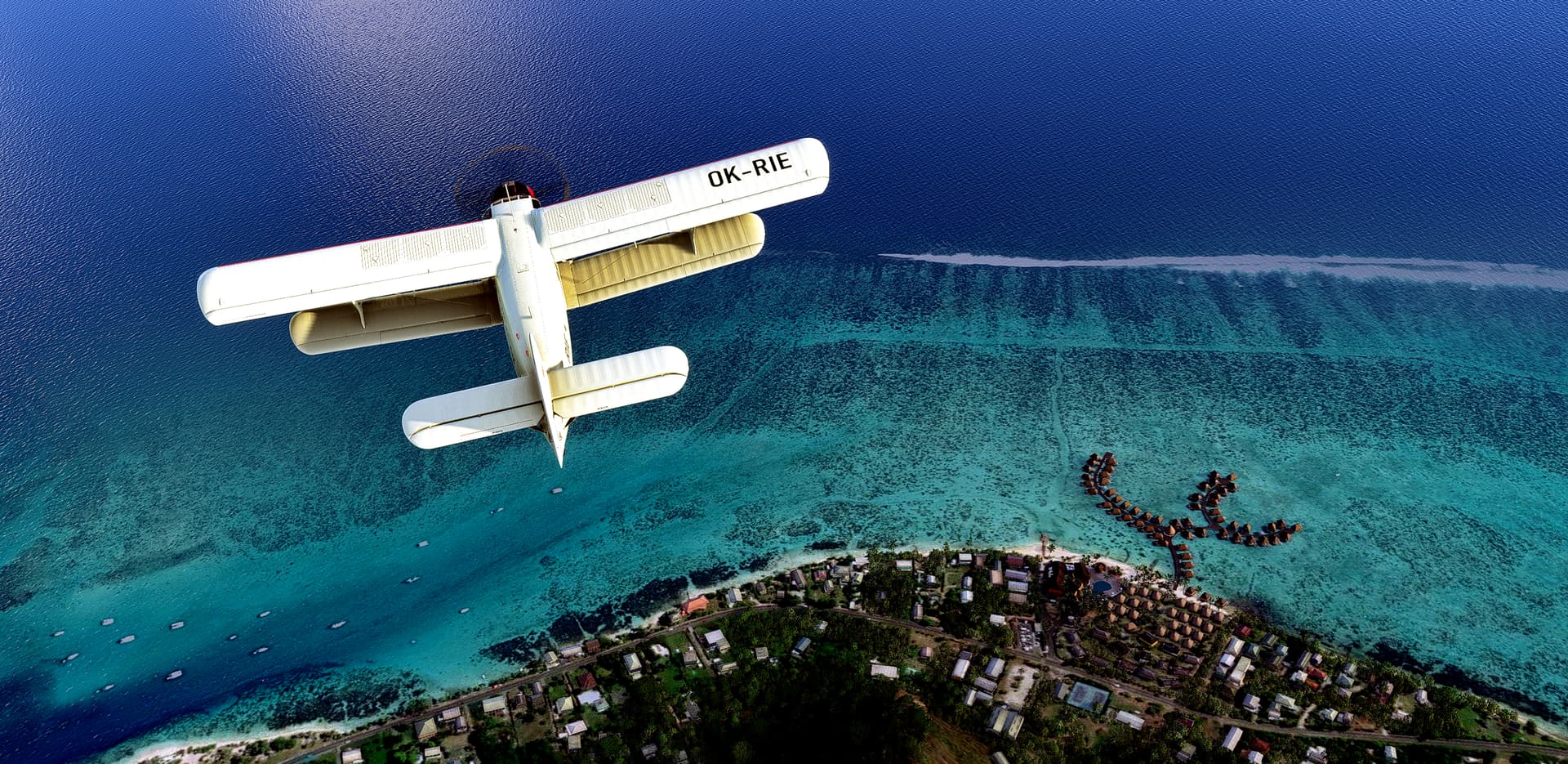 A dual wing propeller aircraft's birds eye view as it flies above a coastline