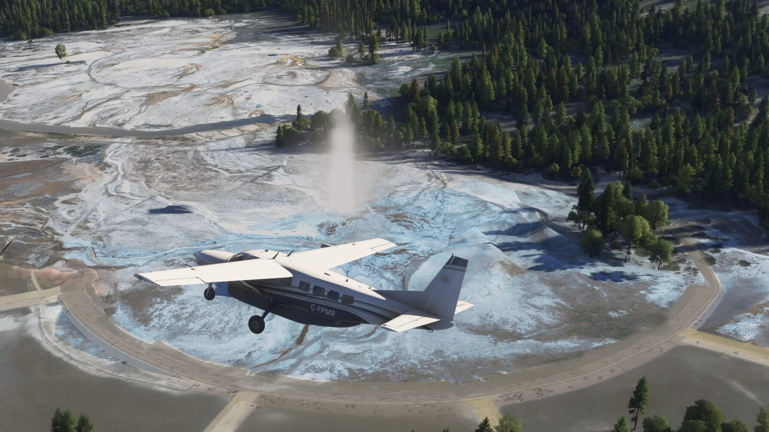 A sightseeing aircraft flies above an erupting geyser in Yellowstone National Park.