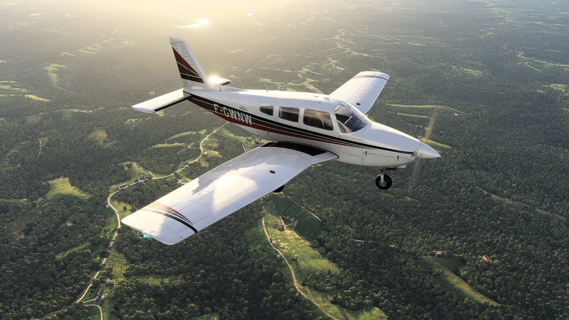 A Piper PA-28-236 Dakota over dense forests