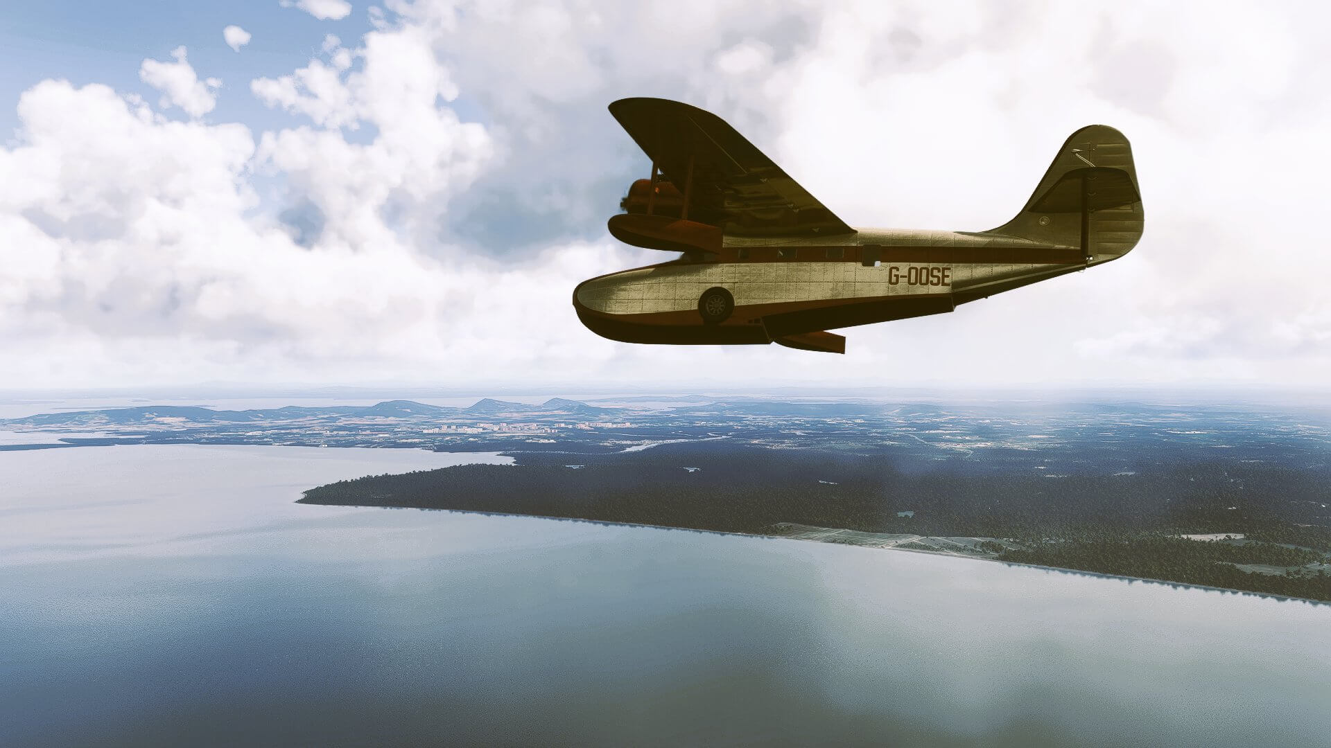 A high-wing propeller aircraft banks right to get a view of the coastline whilst flying over water