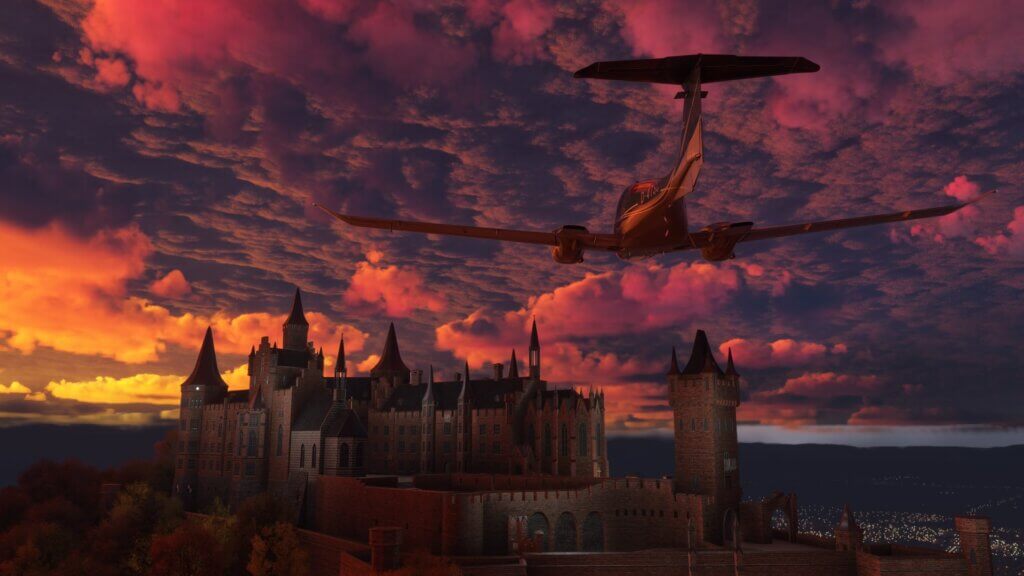 A DA-40 aircraft flies towards a castle with the sun casting red and yellow colors on overcast clouds above