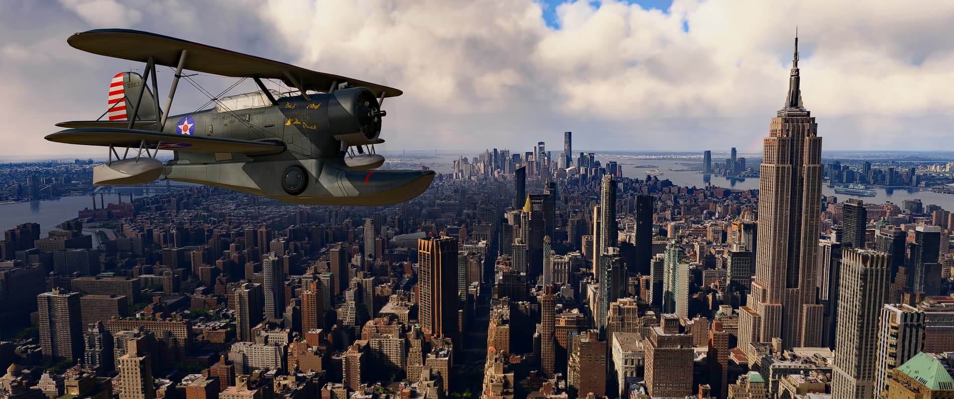 A dual wing propeller aircraft flies over New York city