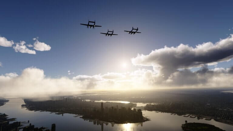 Three propeller aircraft fly in close formation over New York city