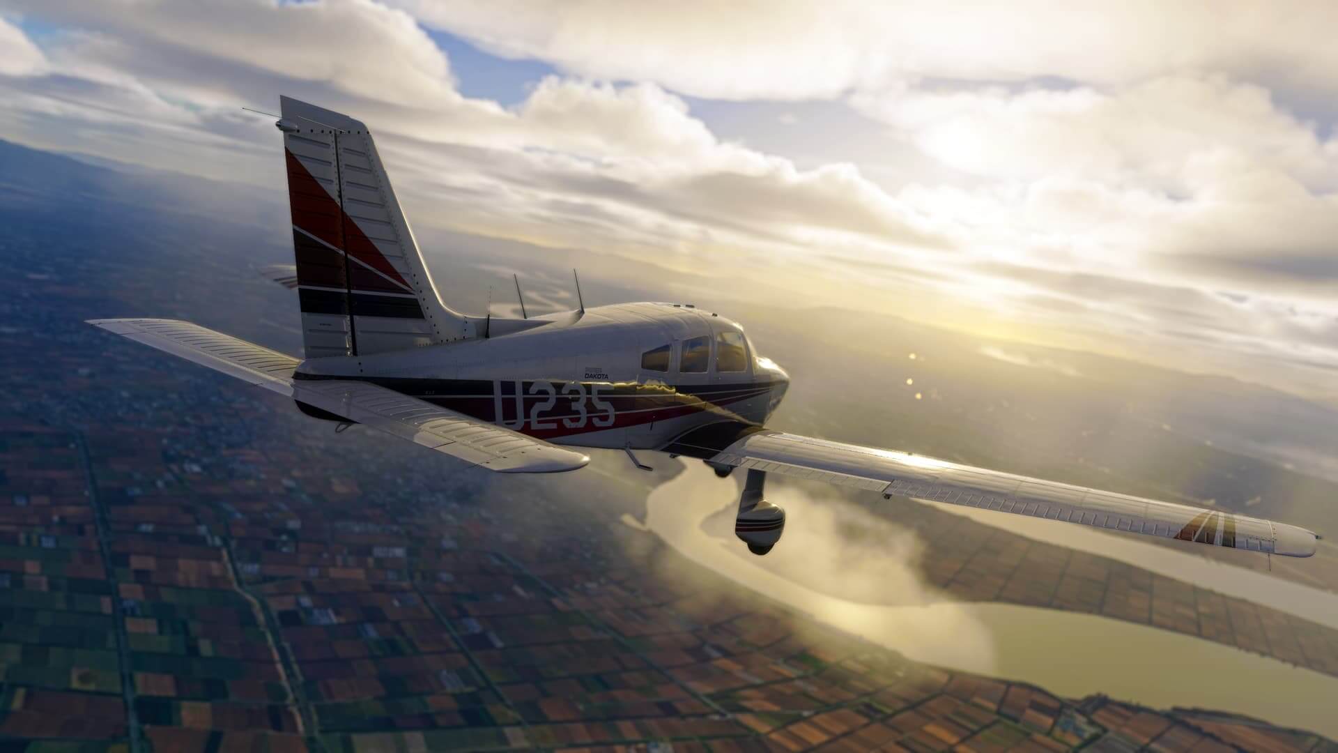 A Piper PA-28-236 Dakota cruises below thick cloud layers