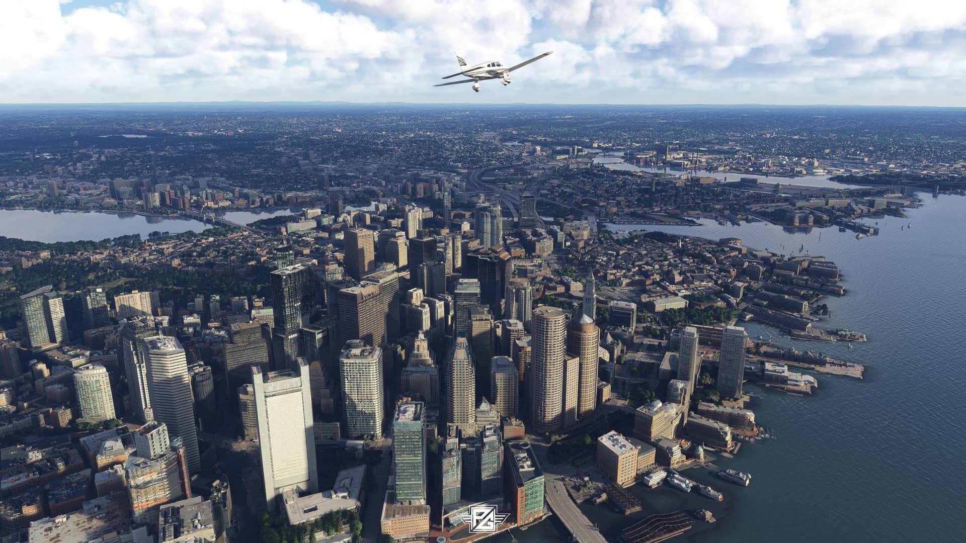 A low wing propeller aircraft flies over a city scape