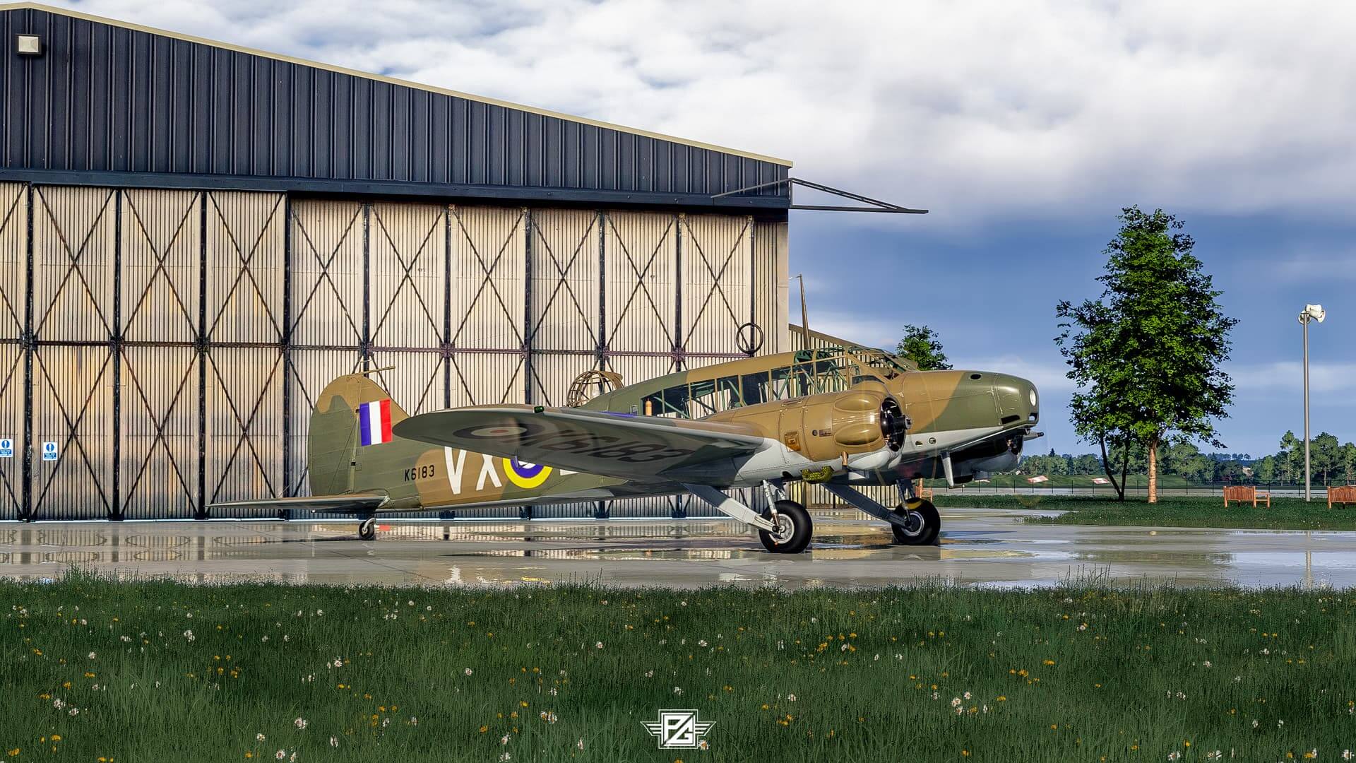 A military propeller aircraft sits idle on a wet airport apron