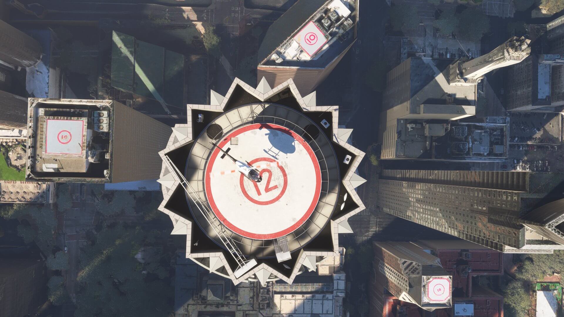 A helicopter prepares to land on a high rise building helipad