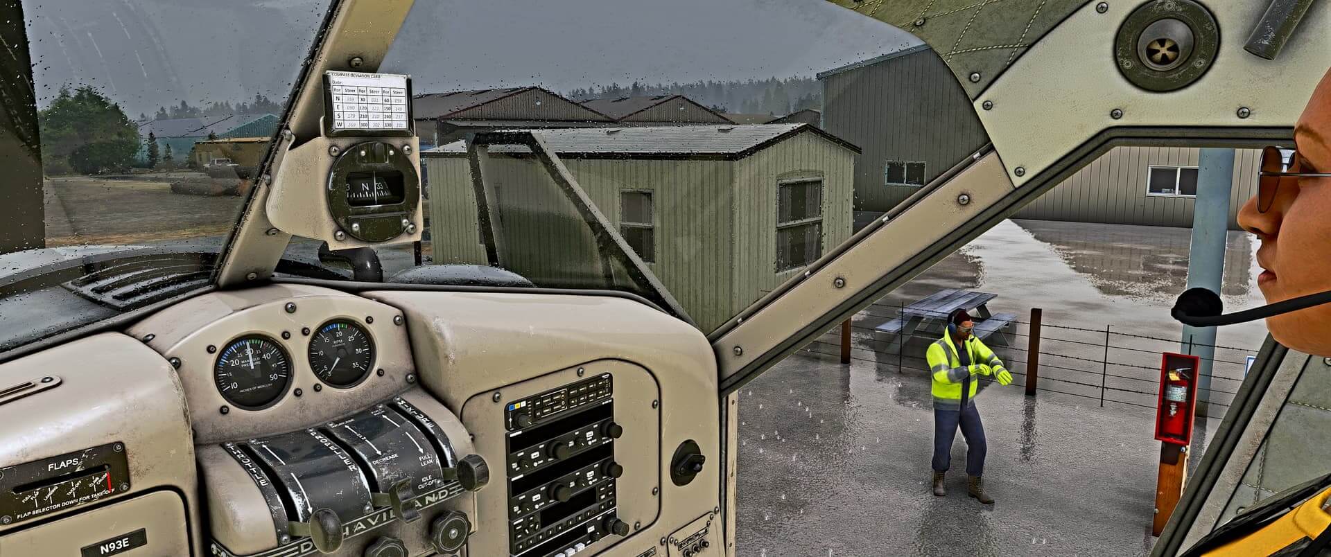 A member of ground crew checks their watch as a pilot prepares their aircraft for flight