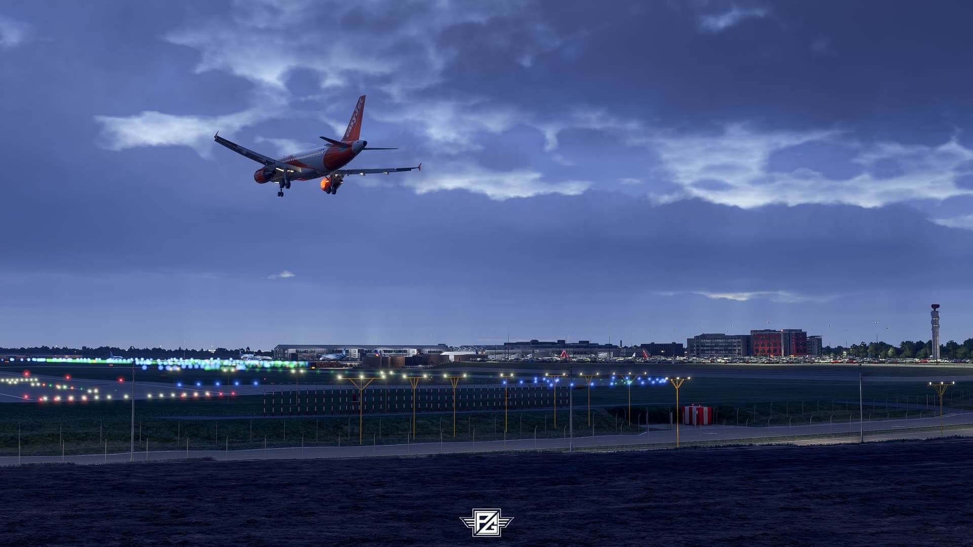 An EasyJet A320 flies over the fence of an airport on approach to land