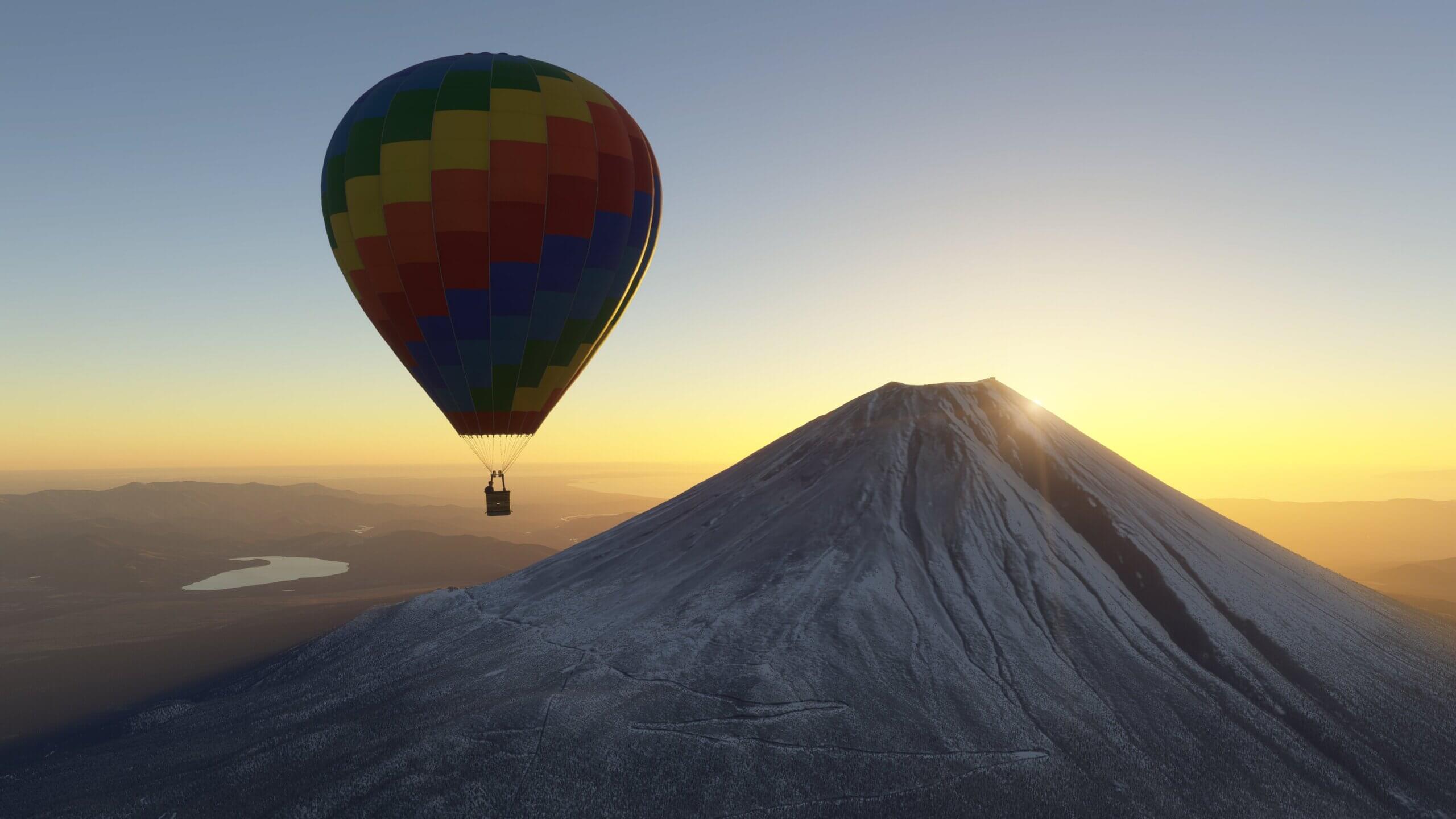 A hot air balloon flies over Mt. Fuji.